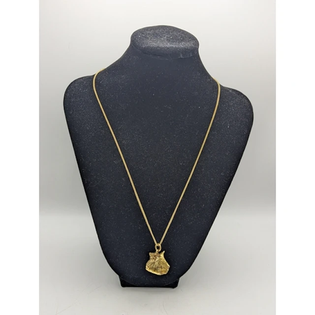 A 14ct yellow gold seashell pendant, stamped 14k, suspended ...