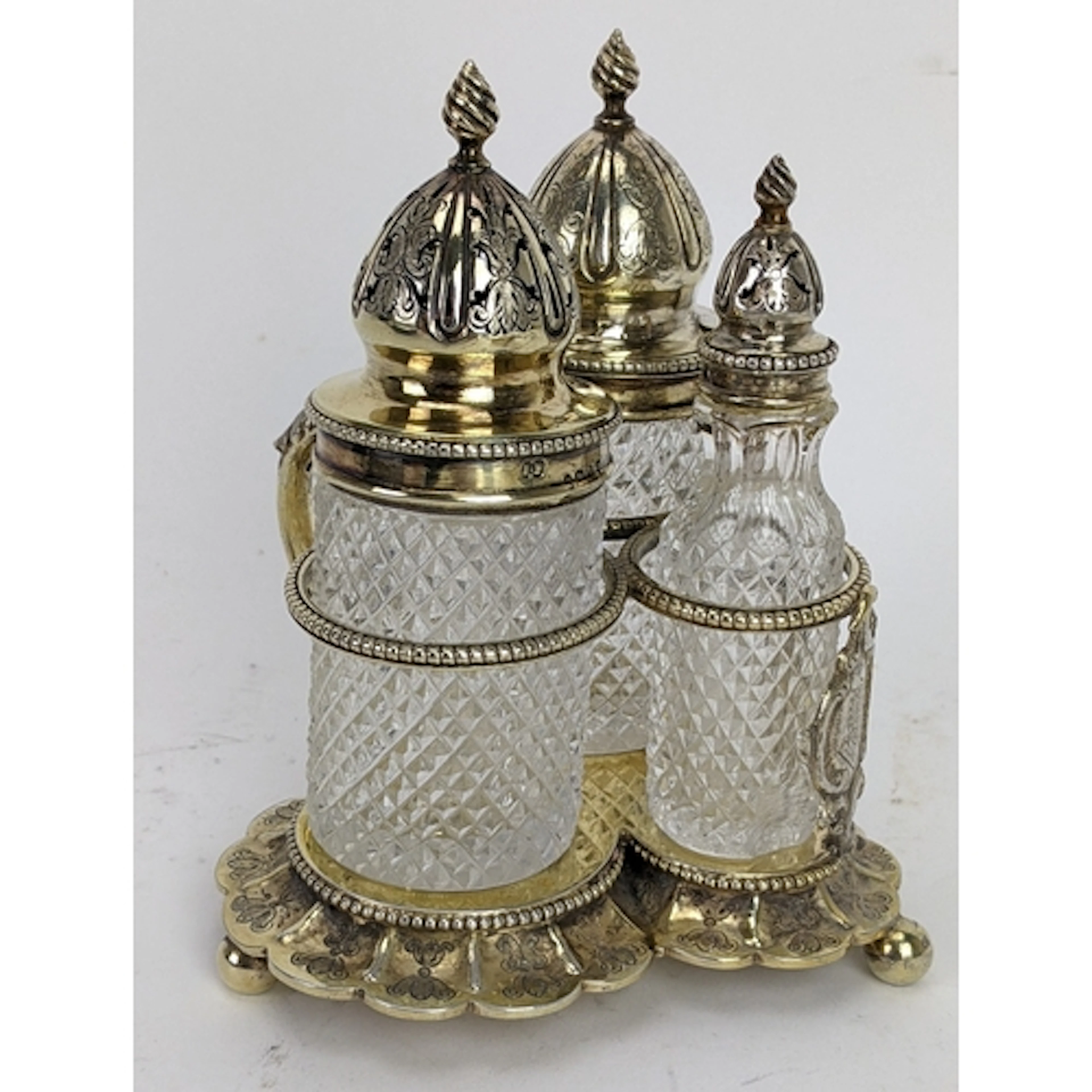 A Victorian silver and glass three-piece cruet set, London 1...