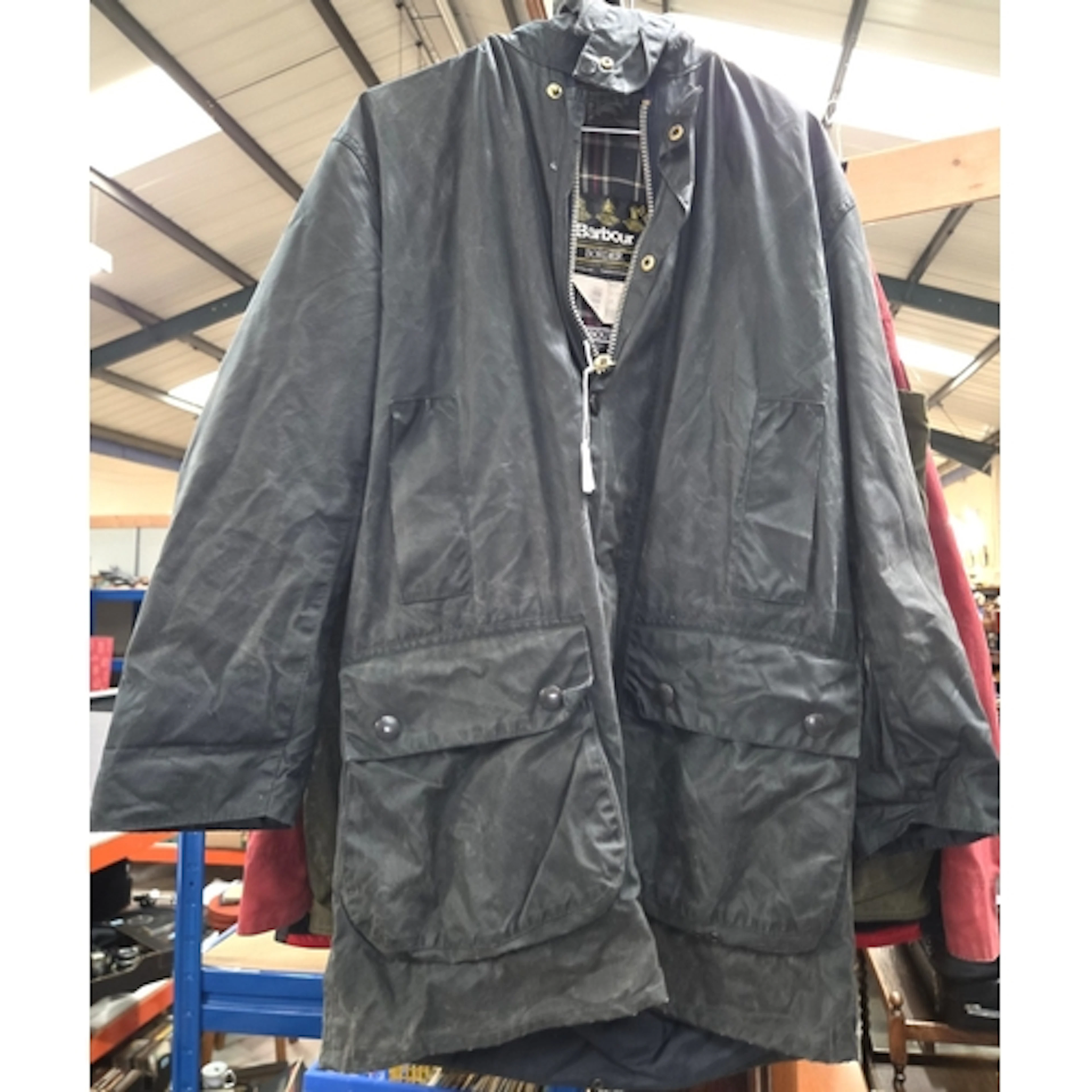 A Barbour Border vintage wax jacket C34, with tartan lining