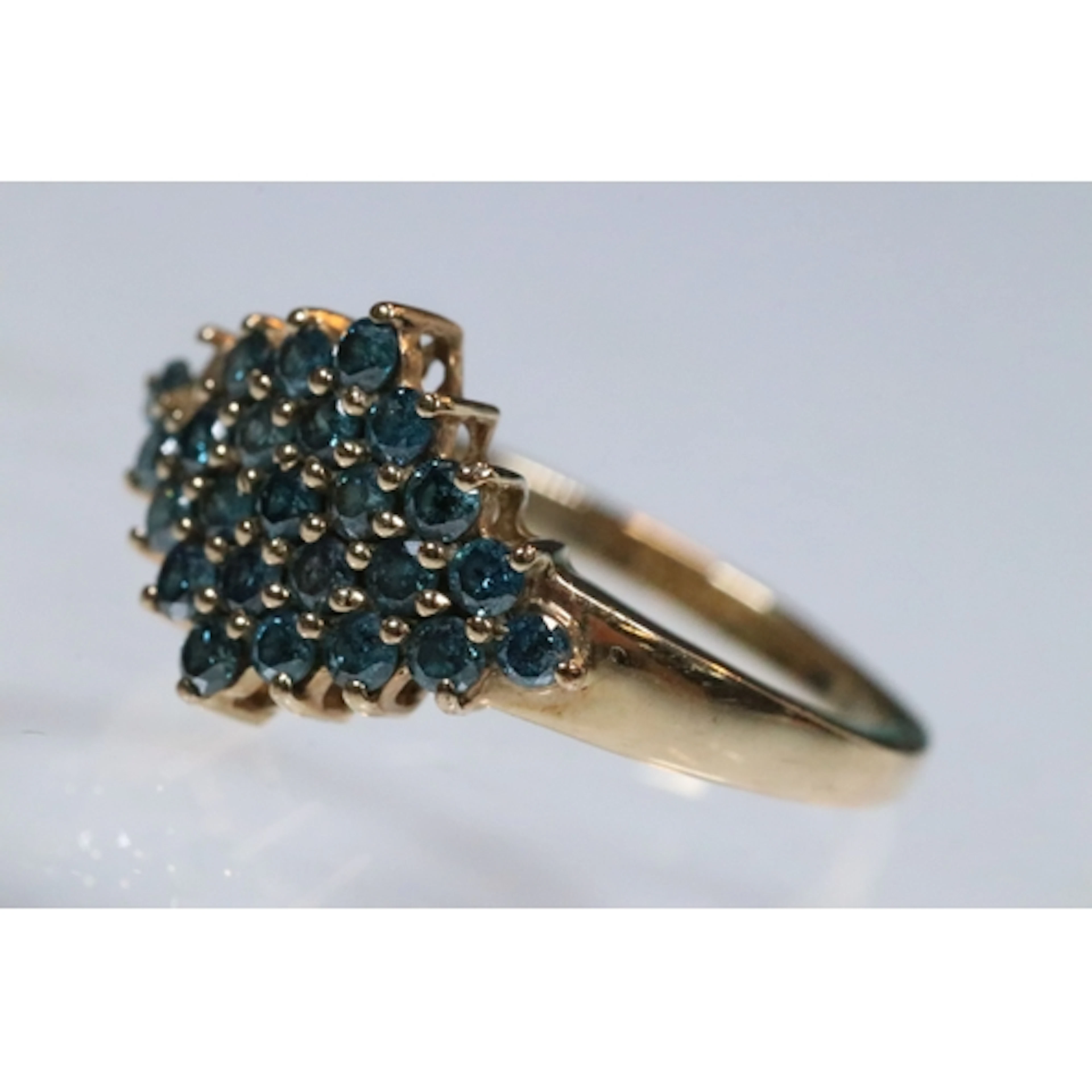 9ct gold and blue diamond ring. Hallmarked London. One stone...