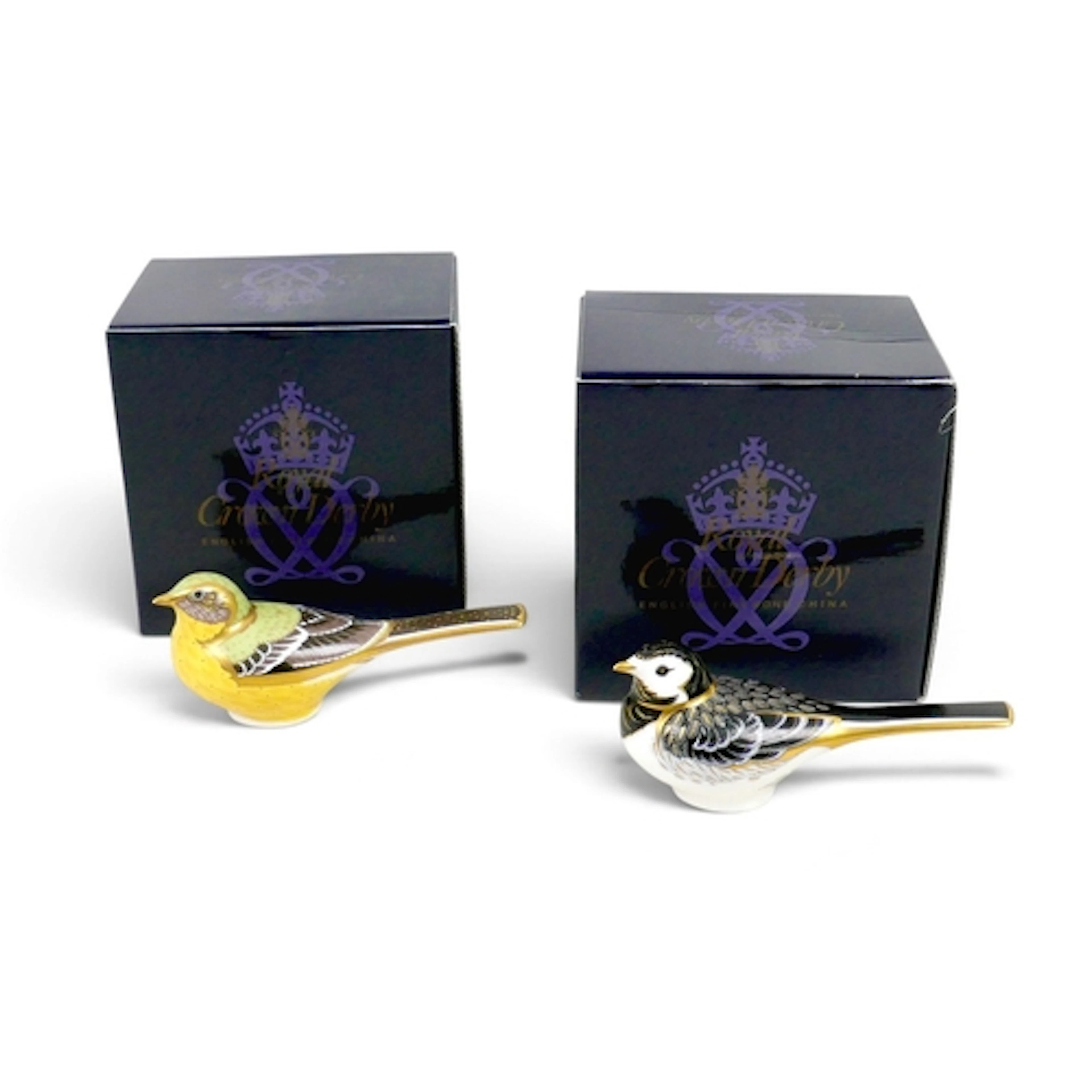 TWO ROYAL CROWN DERBY WAGTAIL PAPERWEIGHTS. comprising a Yel...