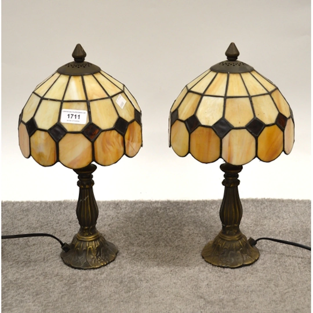Pair of Tiffany style table lamps, with leaded glass shades,...