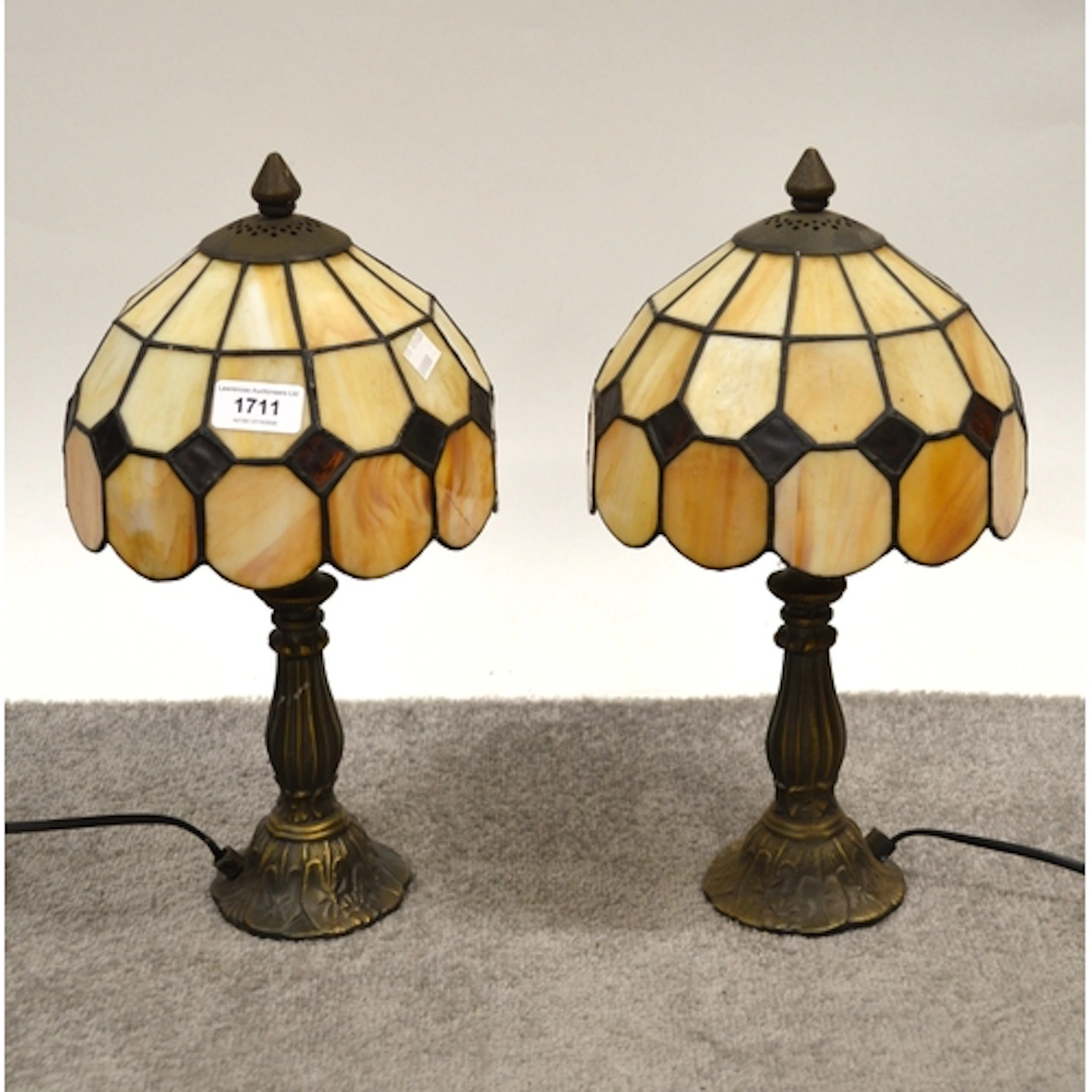 Pair of Tiffany style table lamps, with leaded glass shades,...