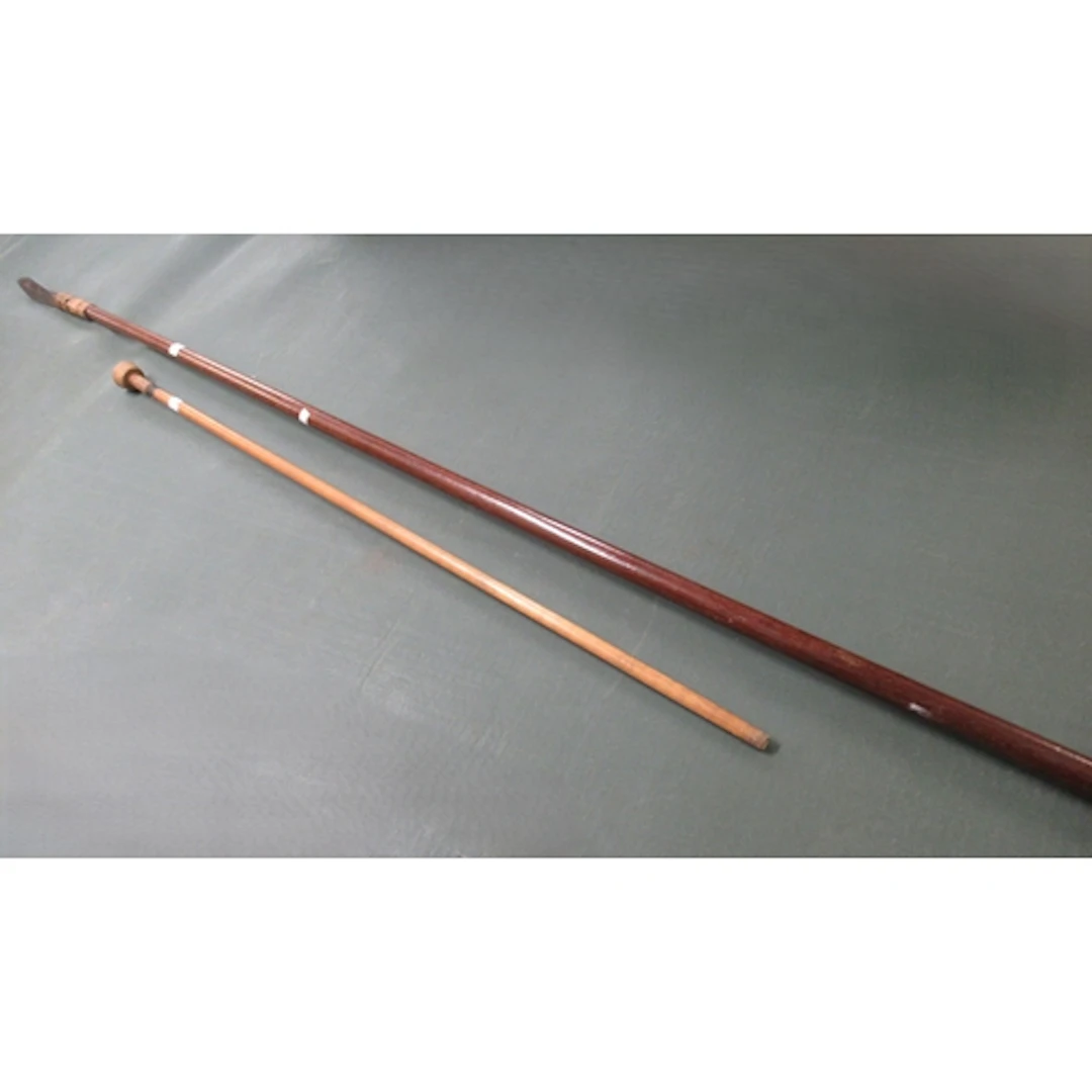 Dayak blow pipe, with iron spear end, together with another ...