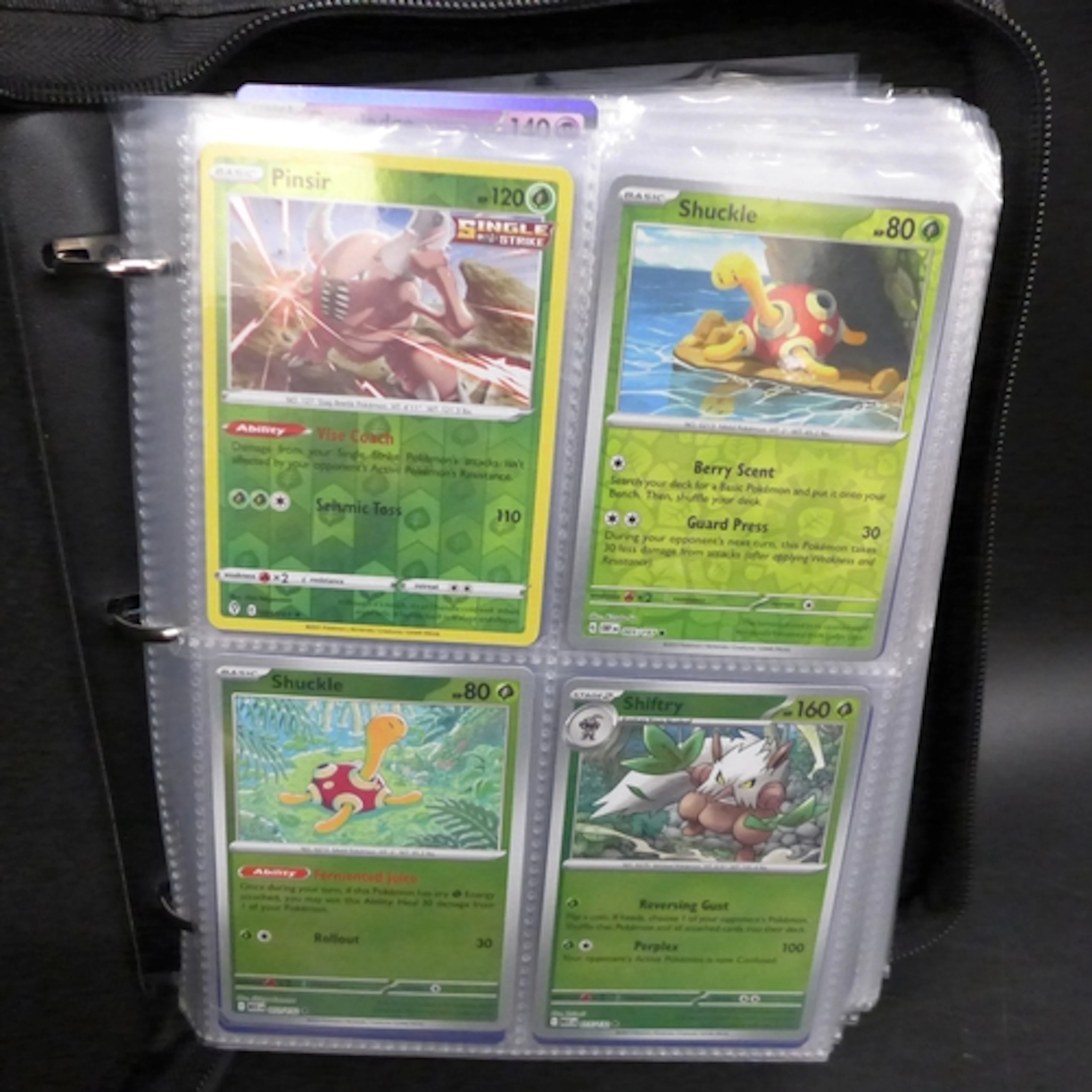 A large Pokémon Trading Card collection in binder containing...
