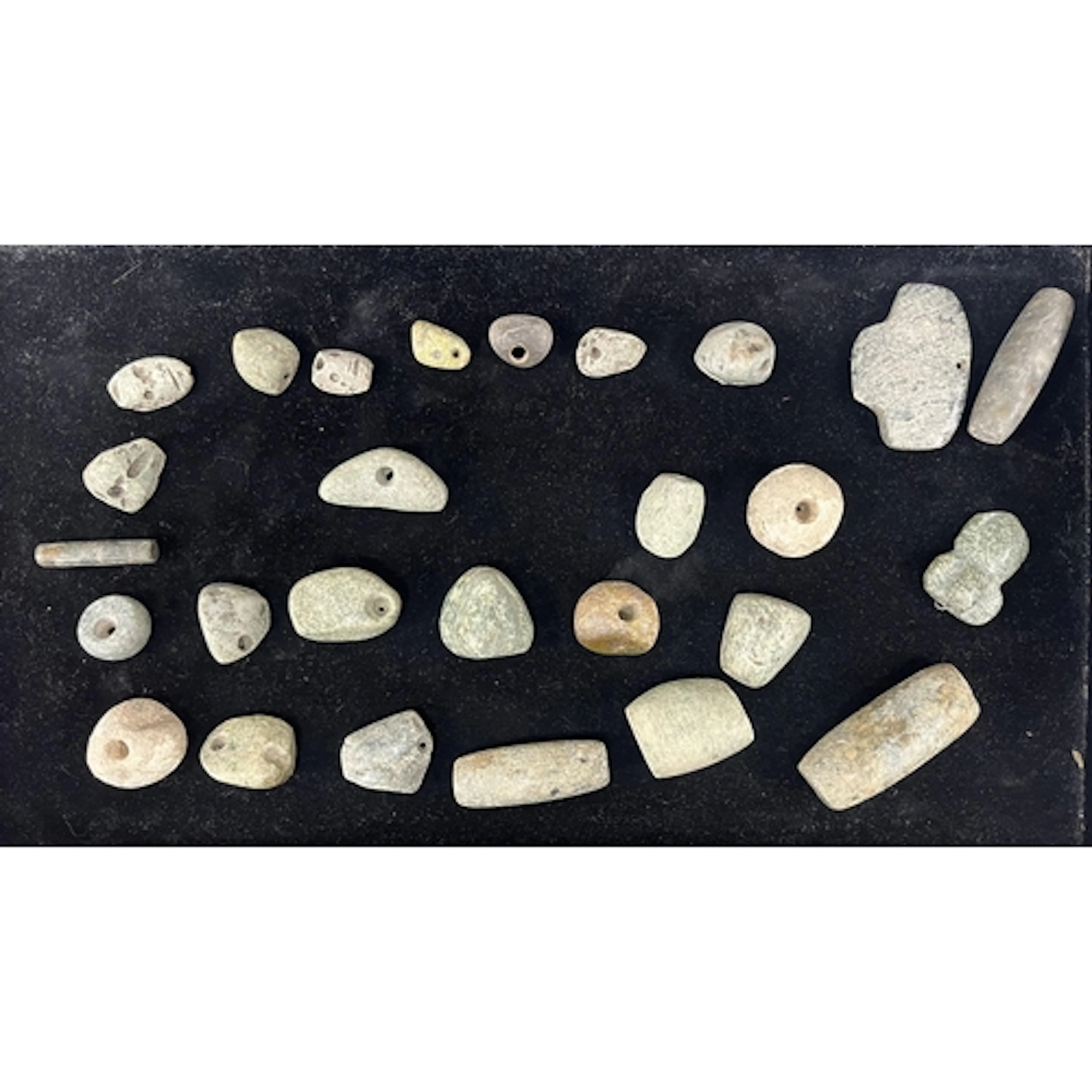 A group of pre-Colombian jadeite and stone beads from a neck...