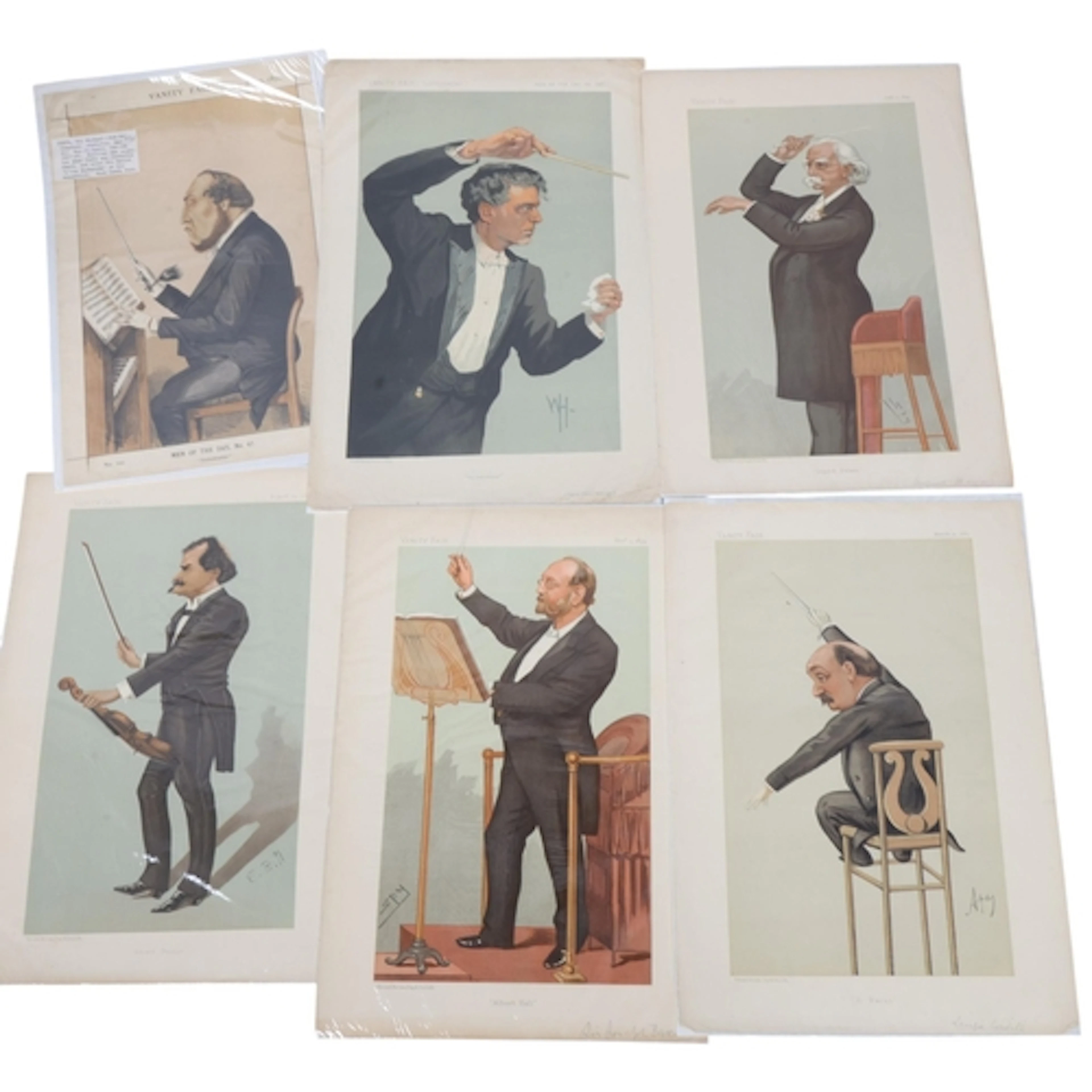 Two folders of Vanity Fair Prints of figures associated with...