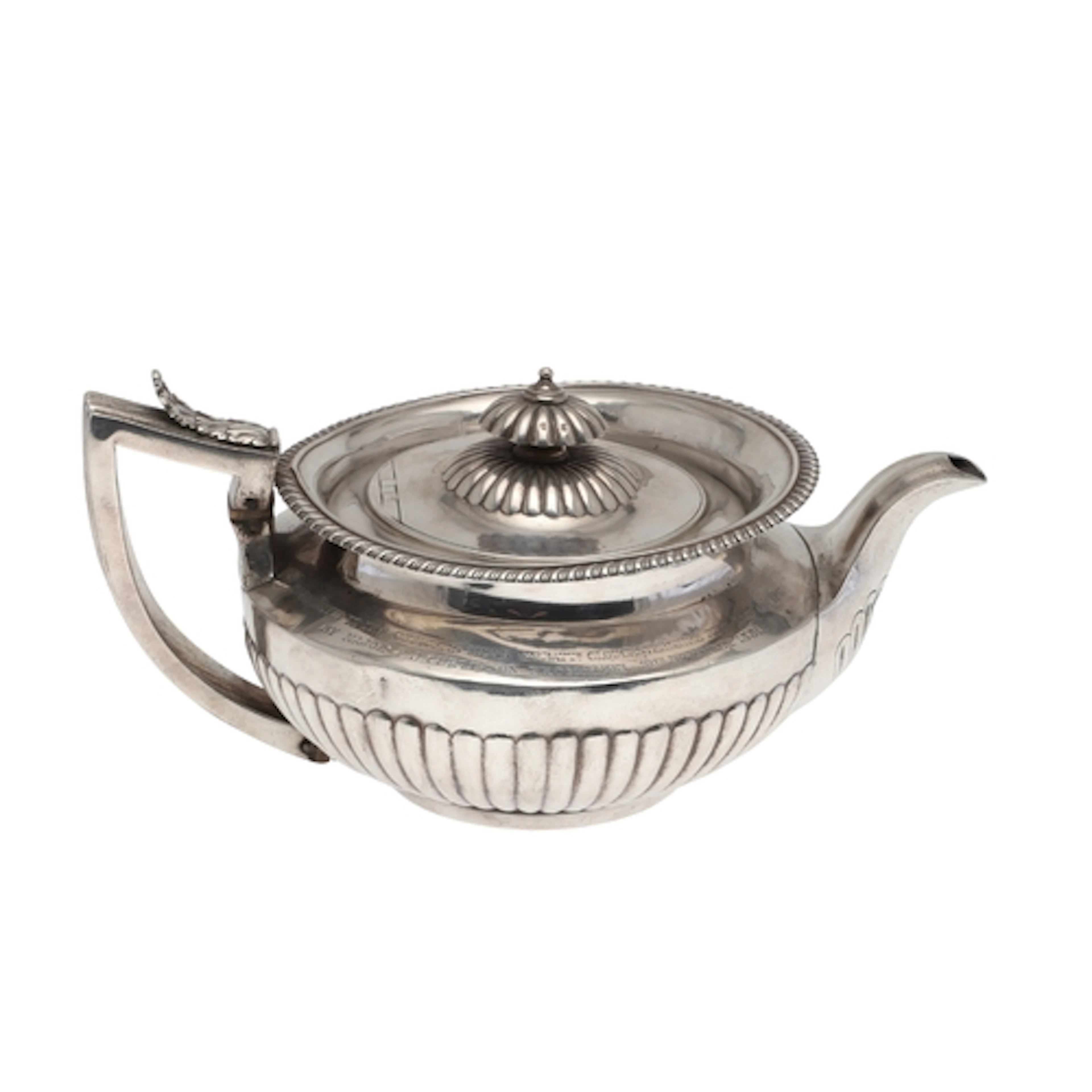 A GEORGE IV SILVER TEA POT. Of round form, with gadrooned de...