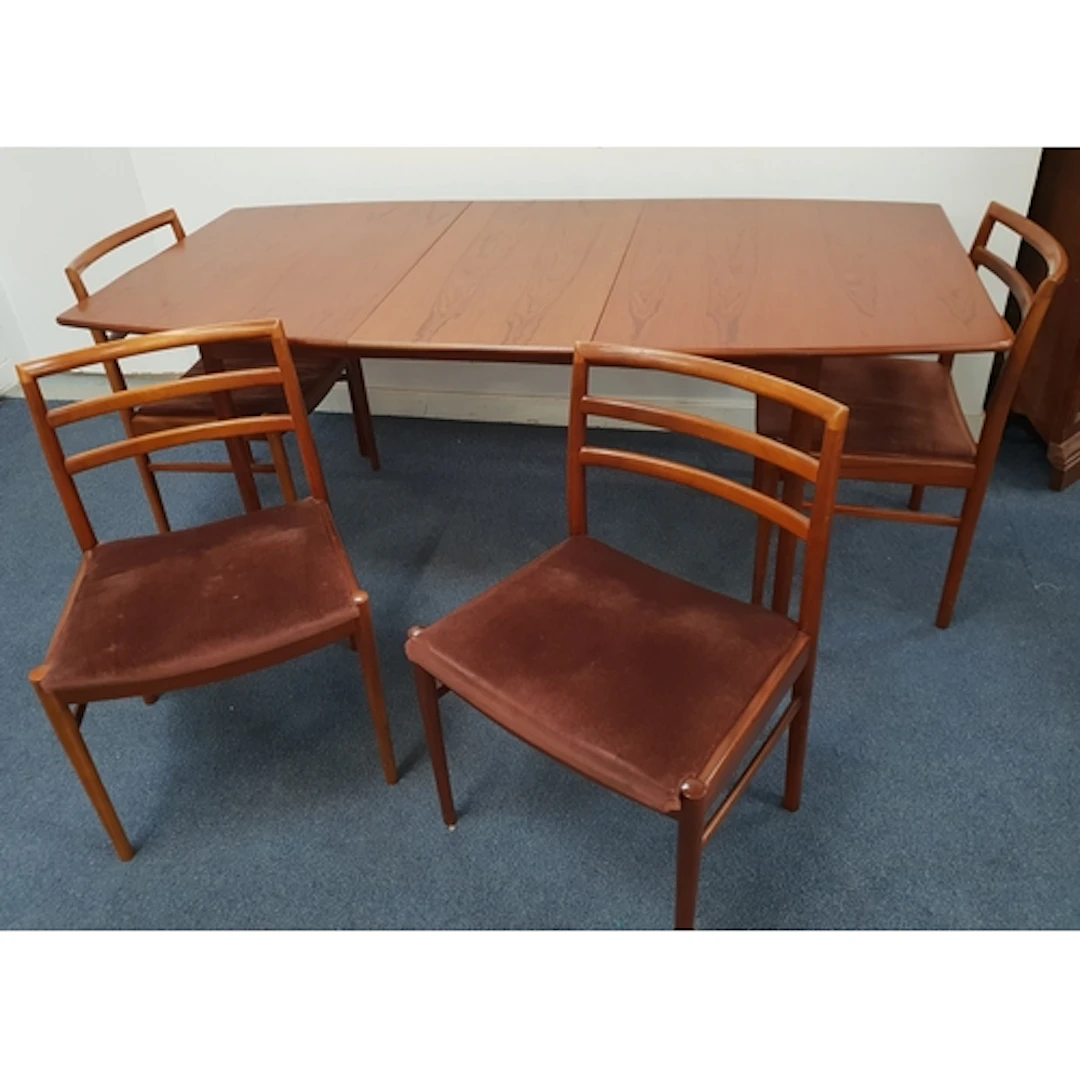 McINTOSH MID-CENTURY TEAK DINING TABLE AND FOUR CHAIRS the t...