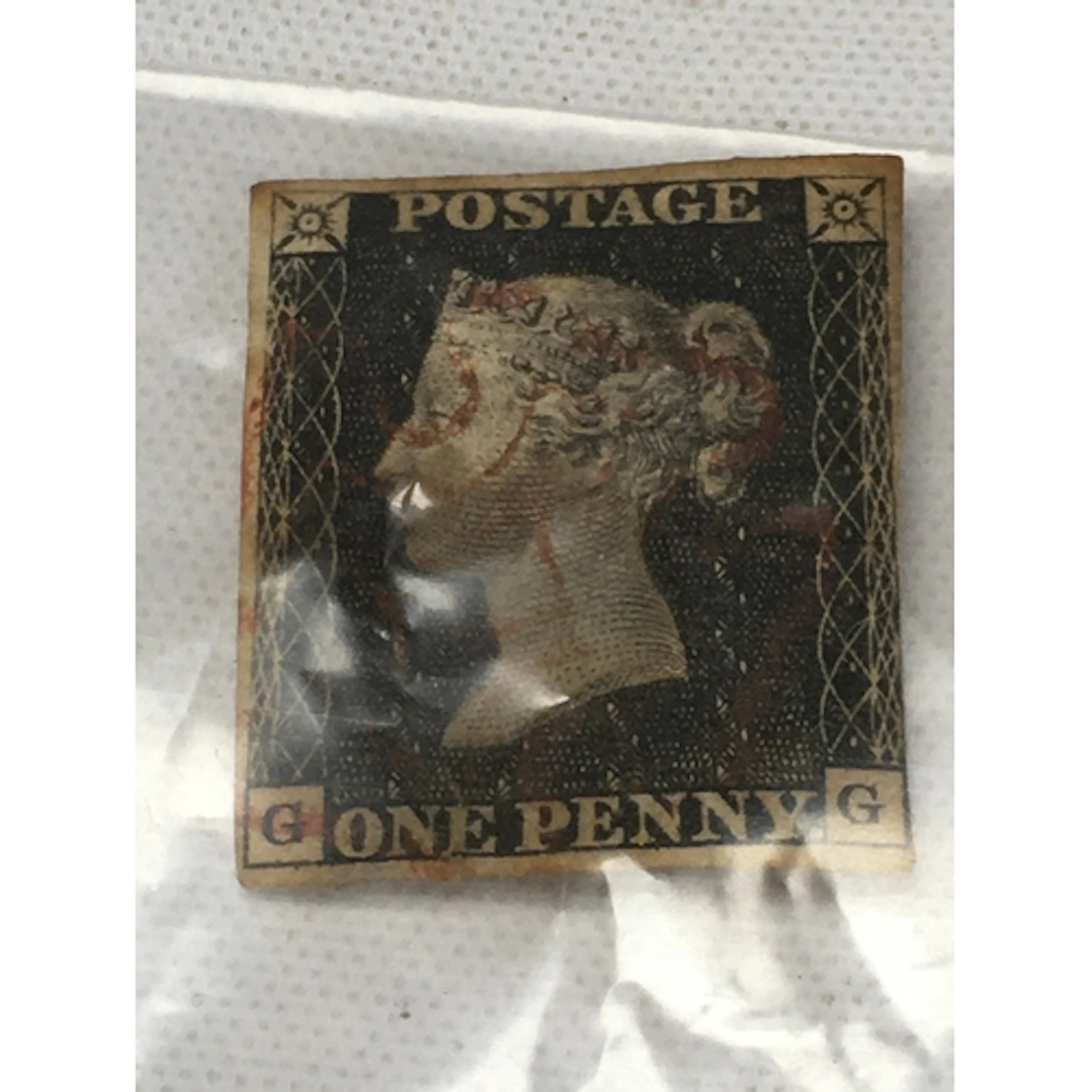 1840s Queen Victoria One Penny Black postage stamp featuring...