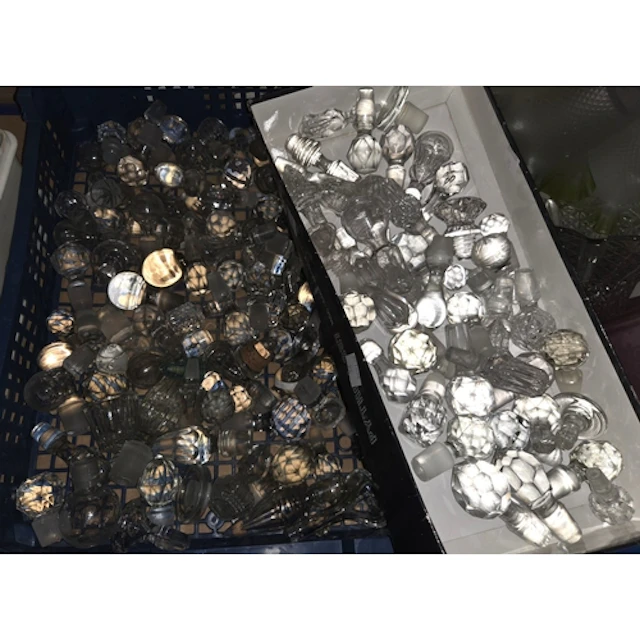 GLASS STOPPERS, a large collection of mostly antique perfume...