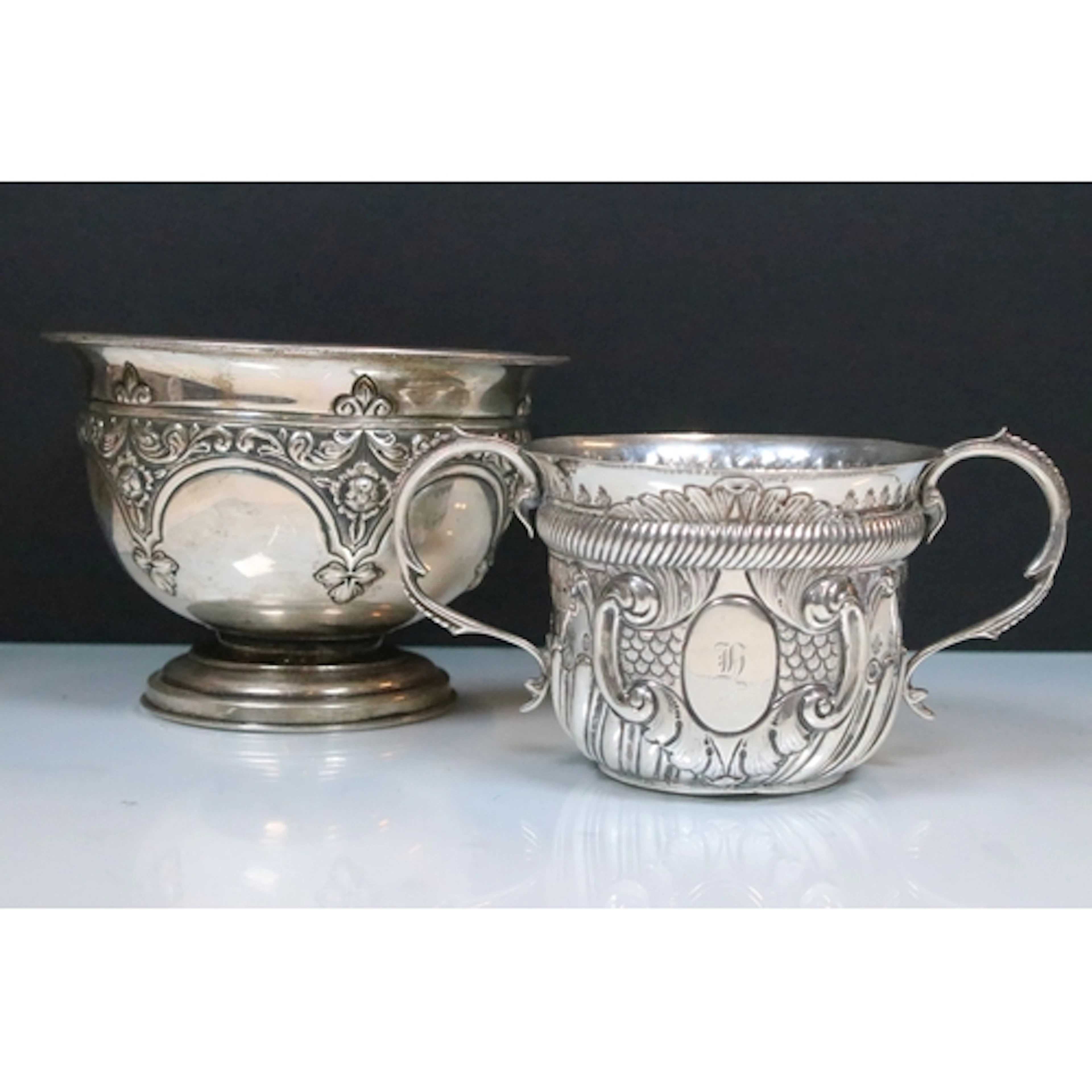 Two hallmarked silver items to include twin handled cup with...
