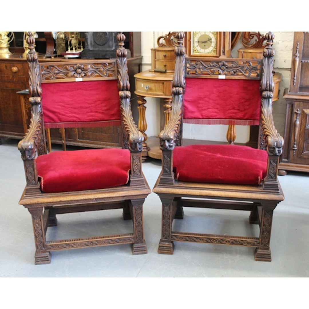 Pair of 19th Century Italian carved walnut open elbow chairs...