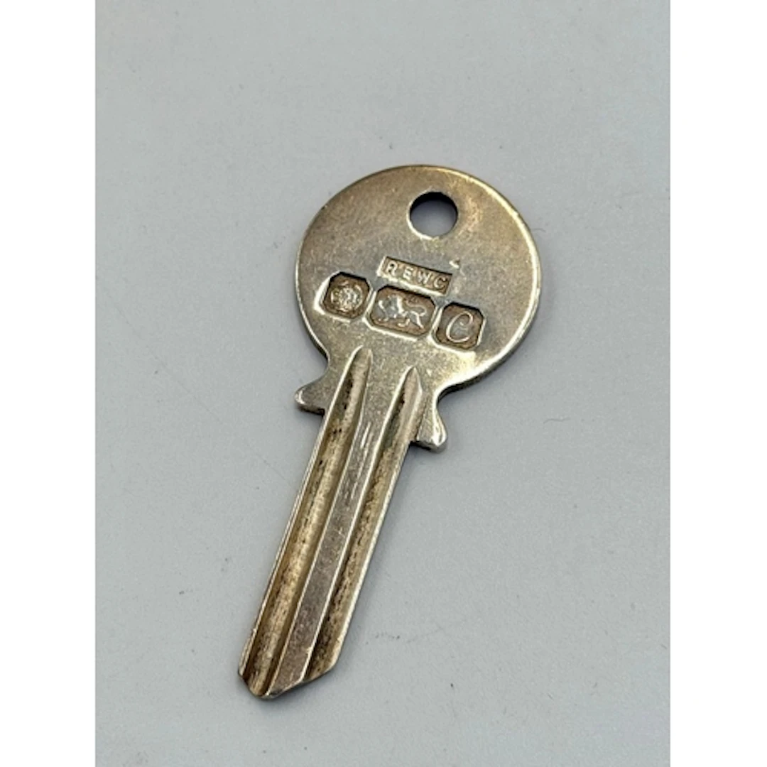 A hallmarked silver key pendant, approximate weight 13g by R...