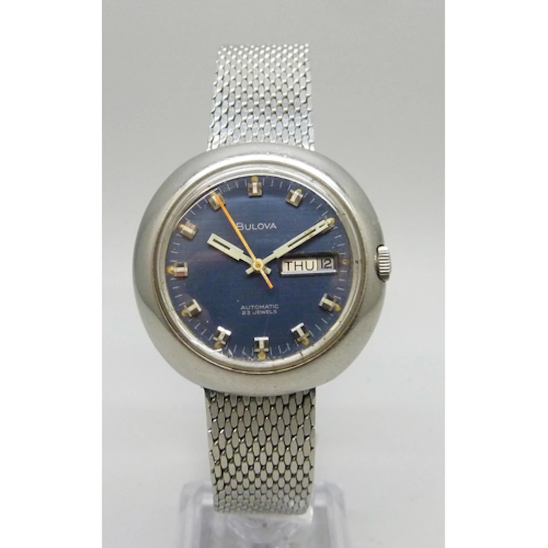 A Bulova automatic wristwatch with blue dial and day/date ap...