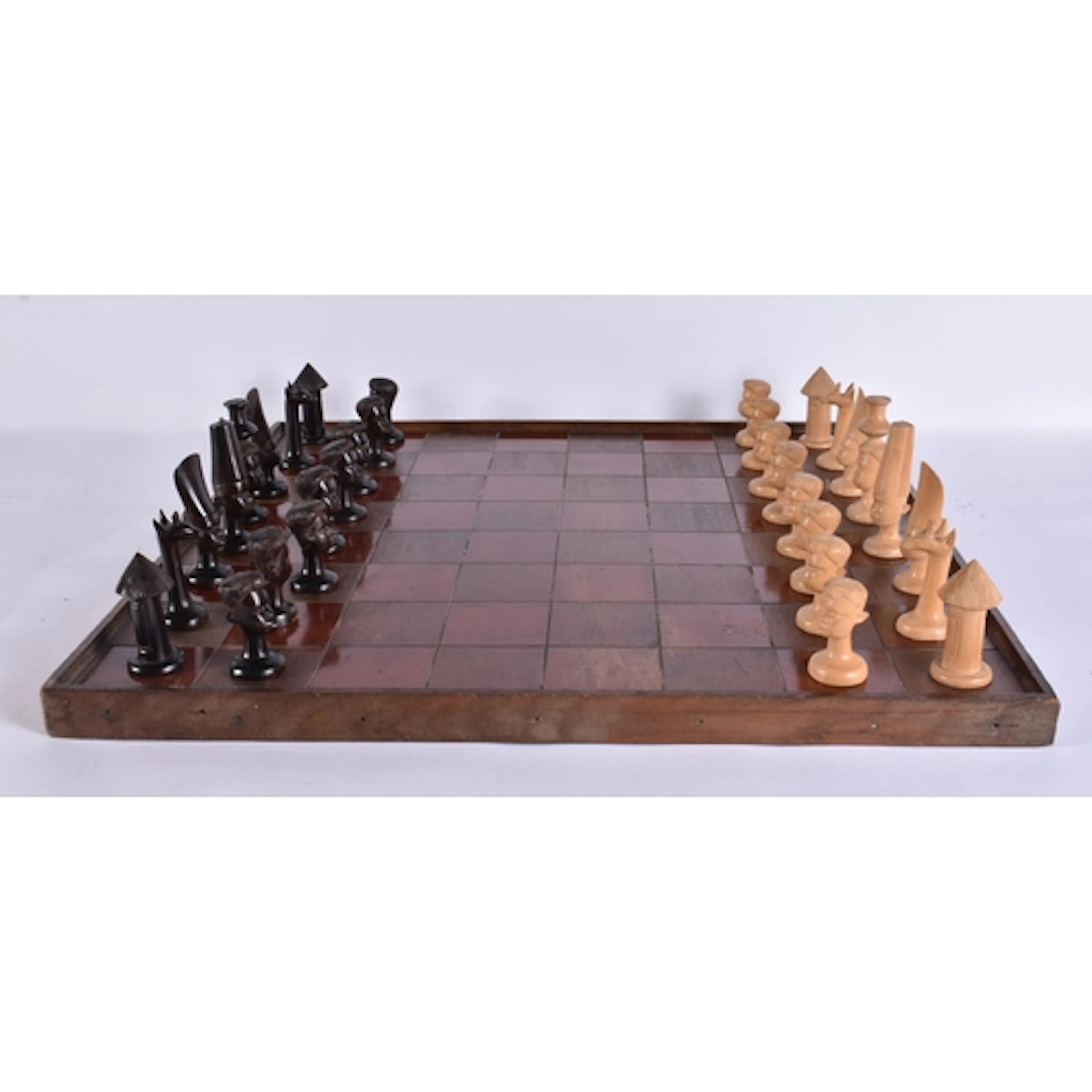 AN AFRICAN WOOD CHESS SET with board. Board 54 cm square. (q...