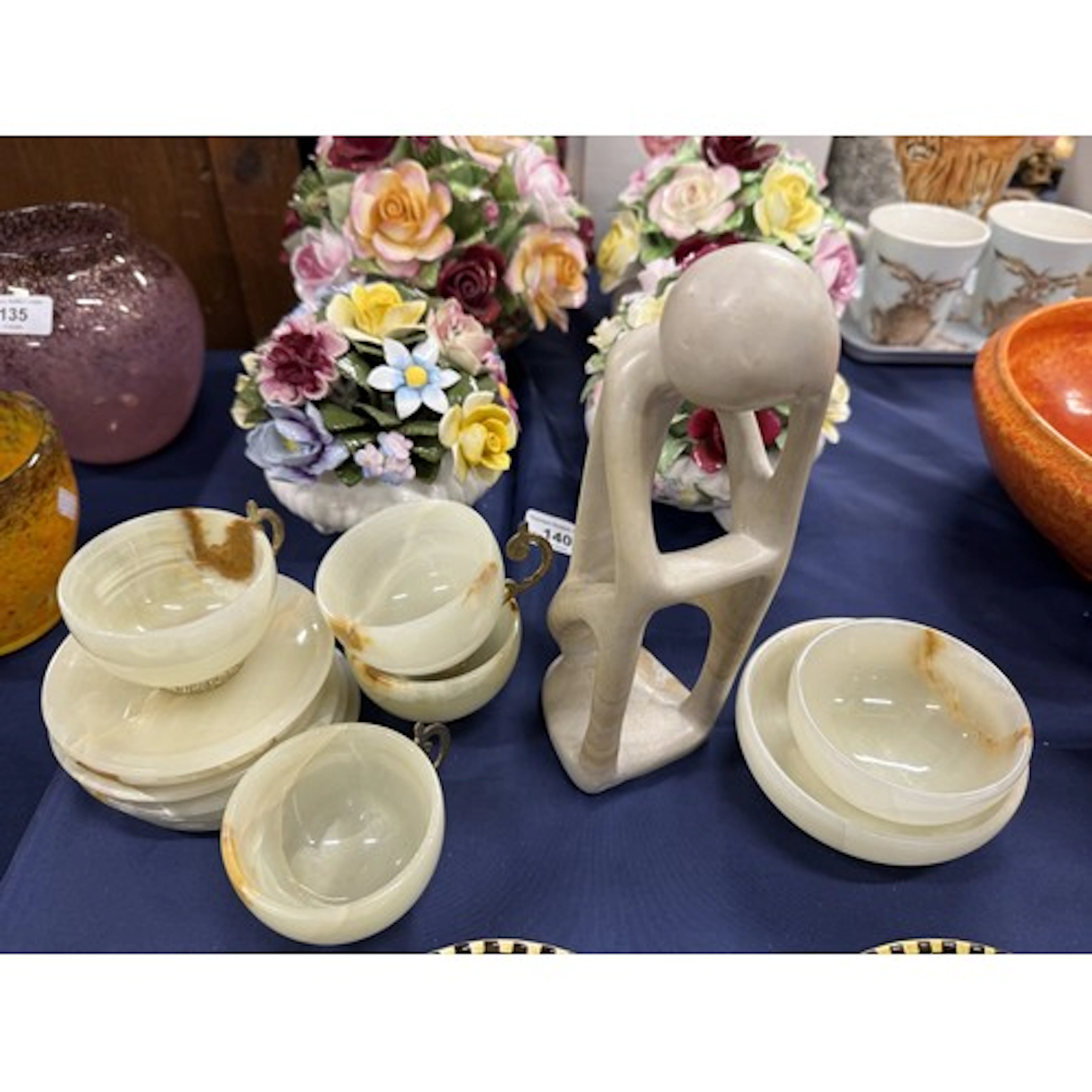 Hardstone abstract figure sculpture, five onyx cups with bra...