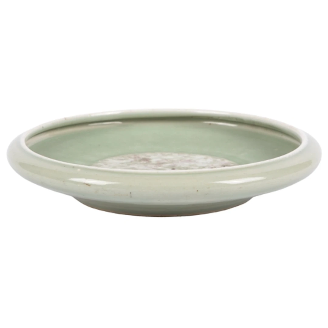 An unusual Chinese underglaze copper red celadon ground dish...