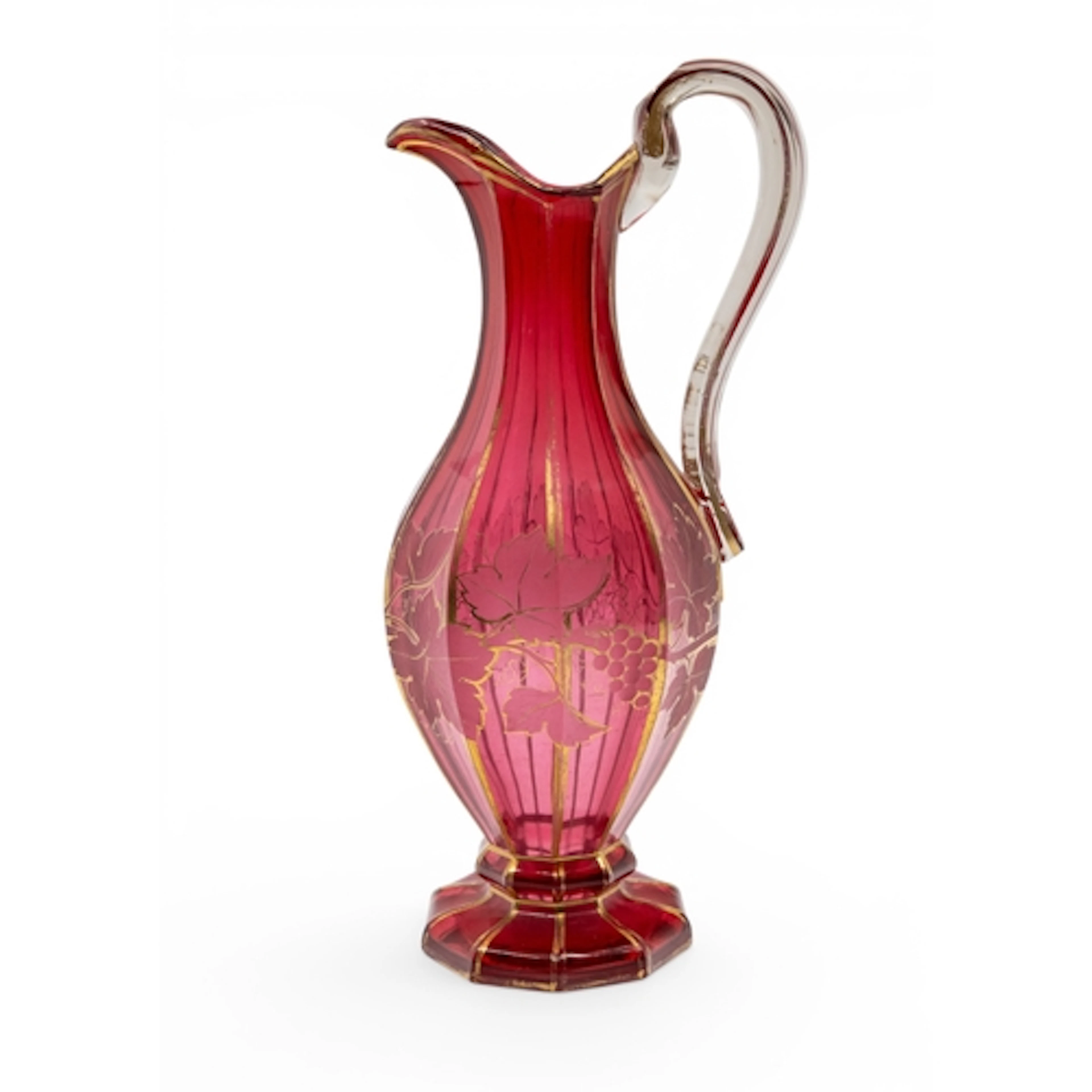 A BOHEMIAN CRANBERRY GLASS EWER faceted decagonal form, deco...