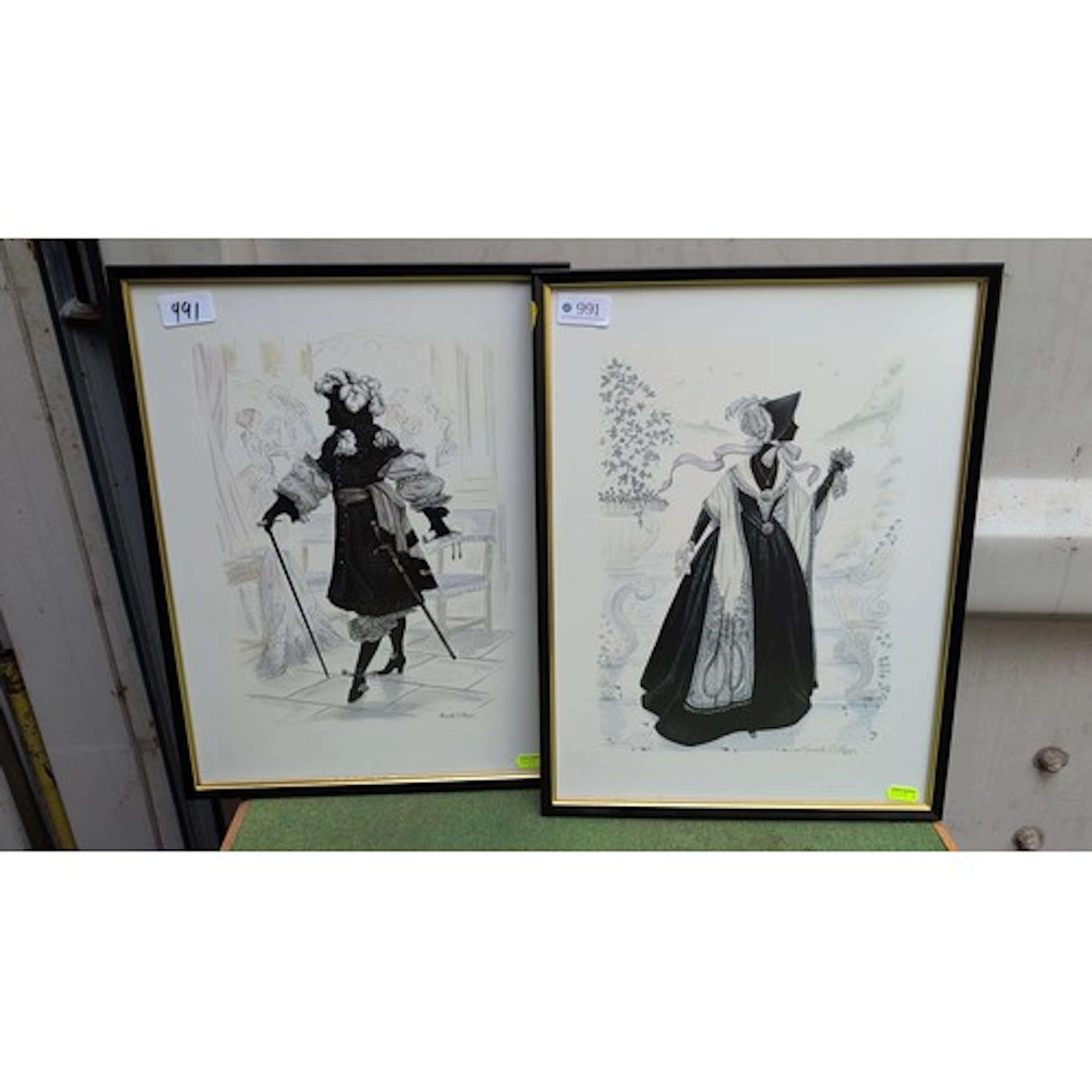 A pair of framed fashion illustrations on paper depicting el...