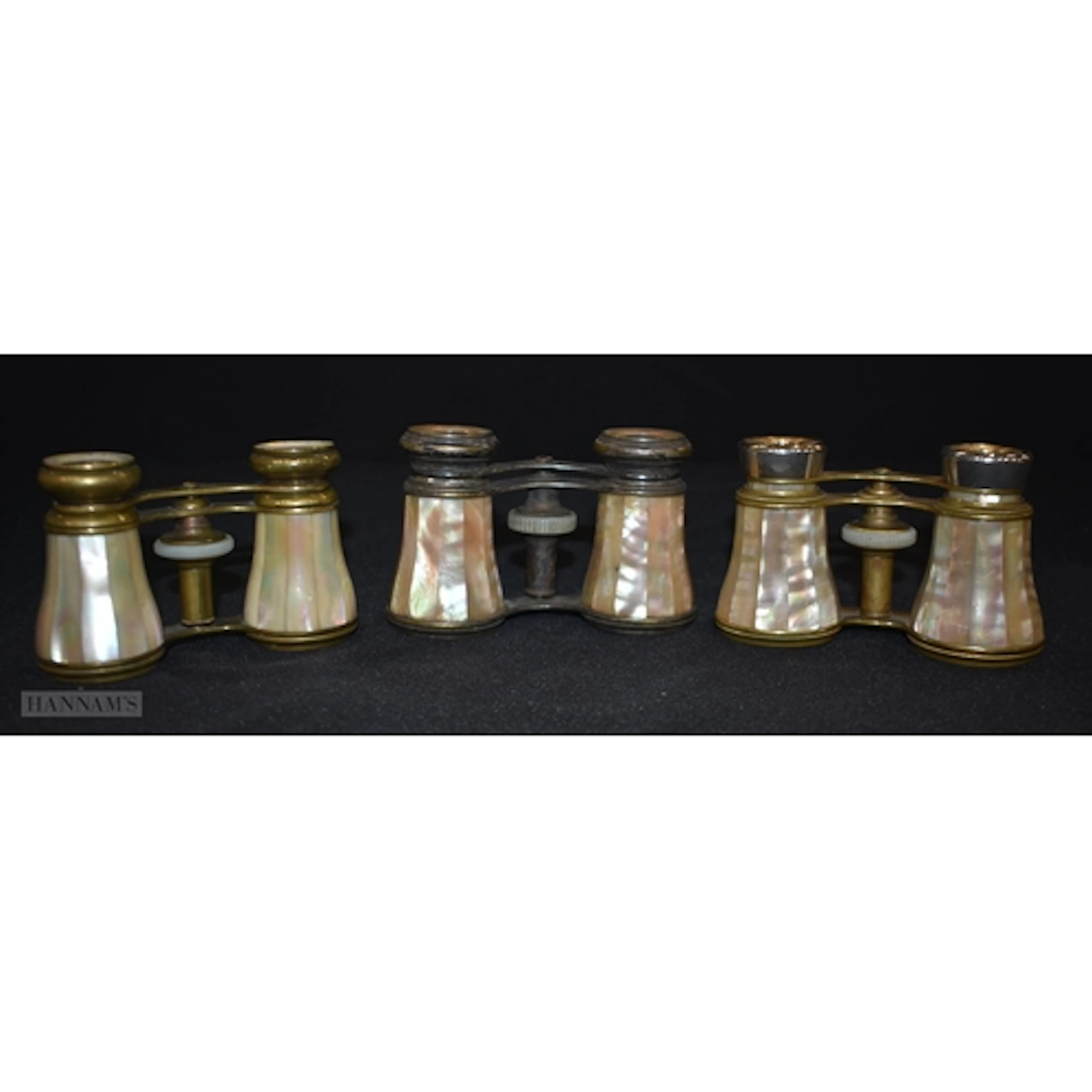 A collection of Mother of Pearl double coated opera glasses ...