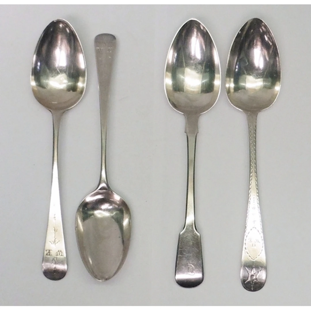 A pair of George III silver old english pattern table spoons...