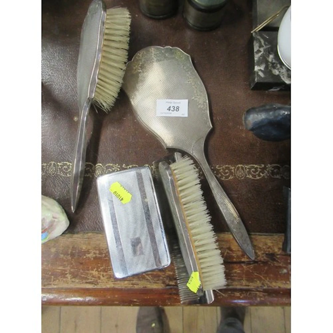 A silver mounted dressing table set
