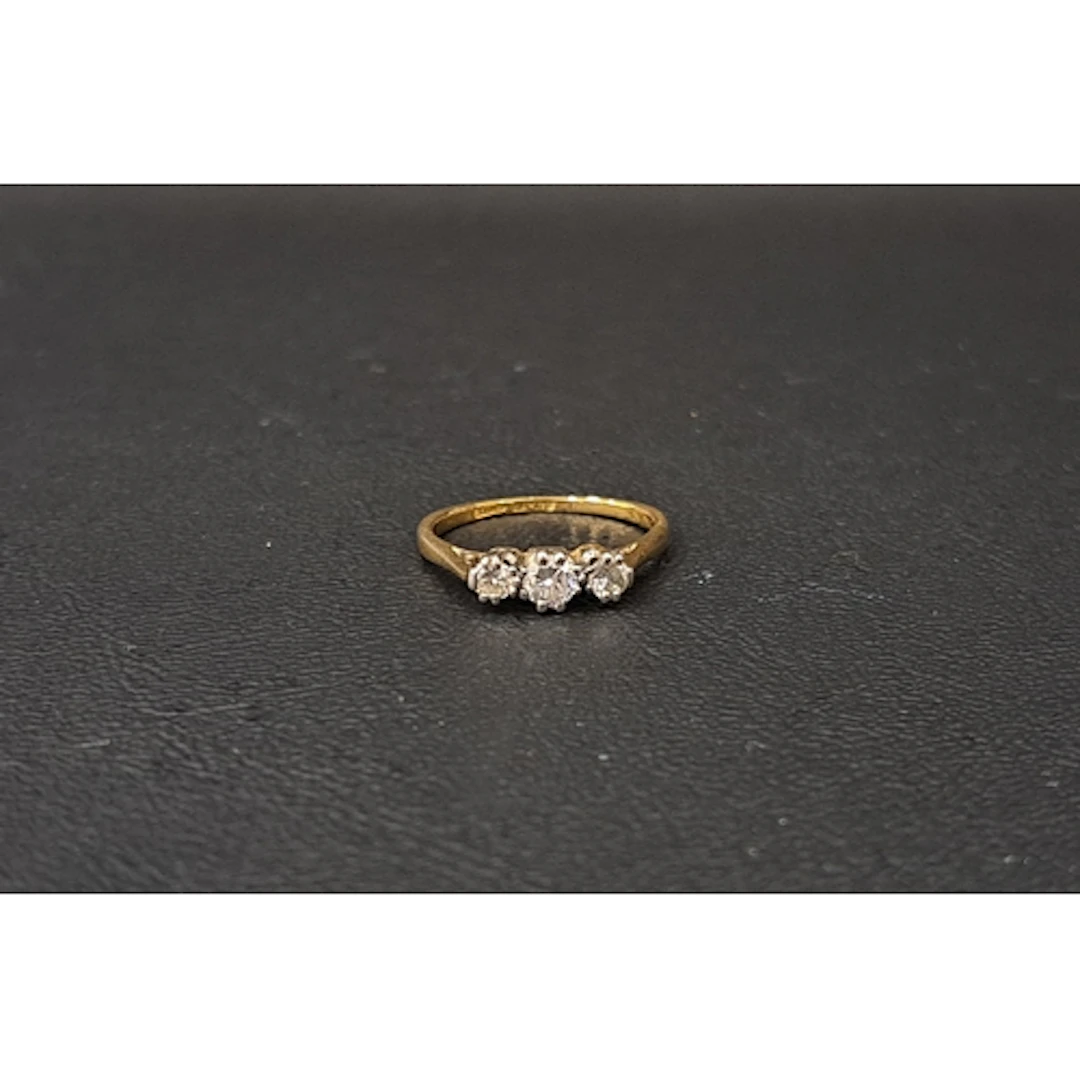 GRADUATED DIAMOND THREE STONE RING the round brilliant cut d...