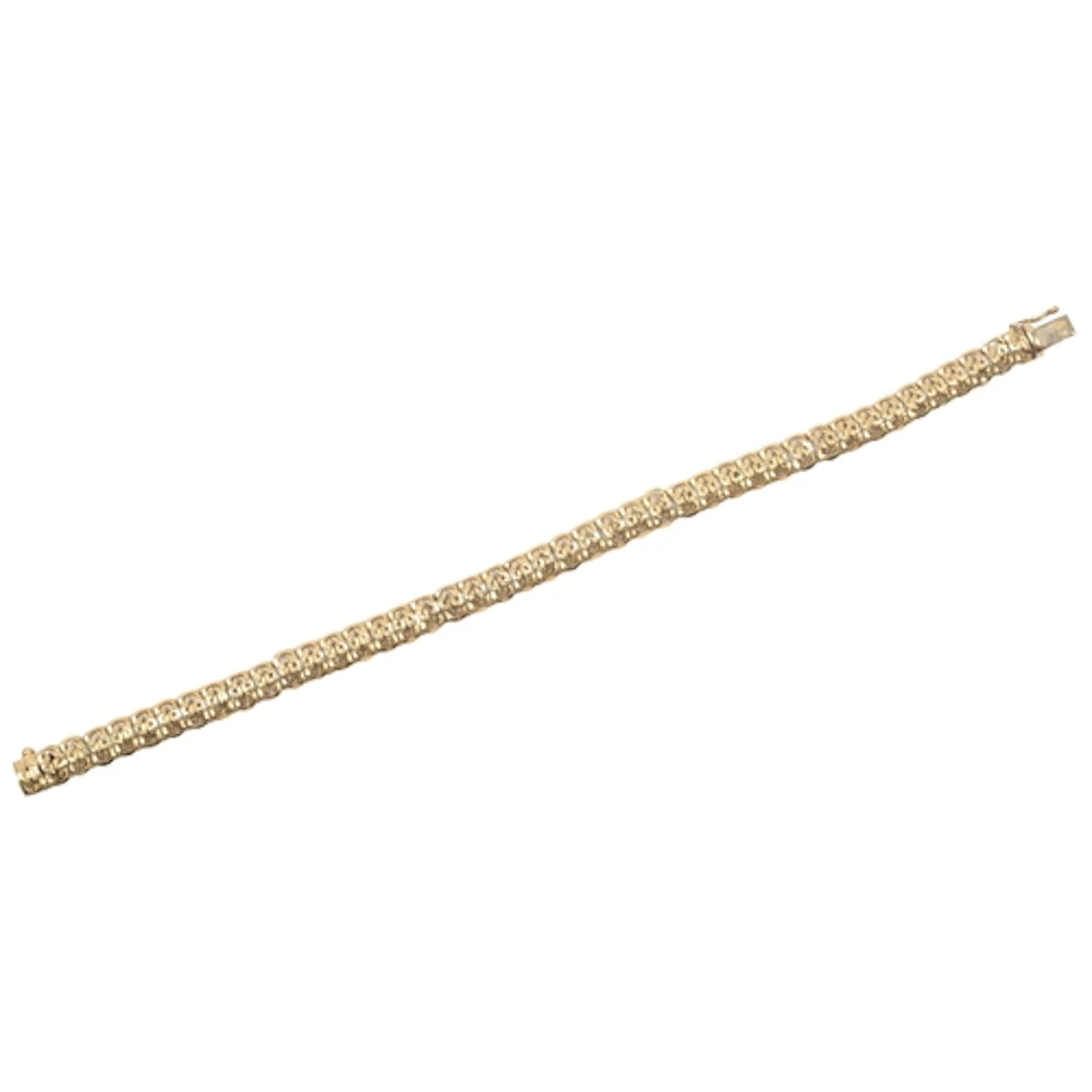A gold bracelet, composed of fancy linking with engraved det...