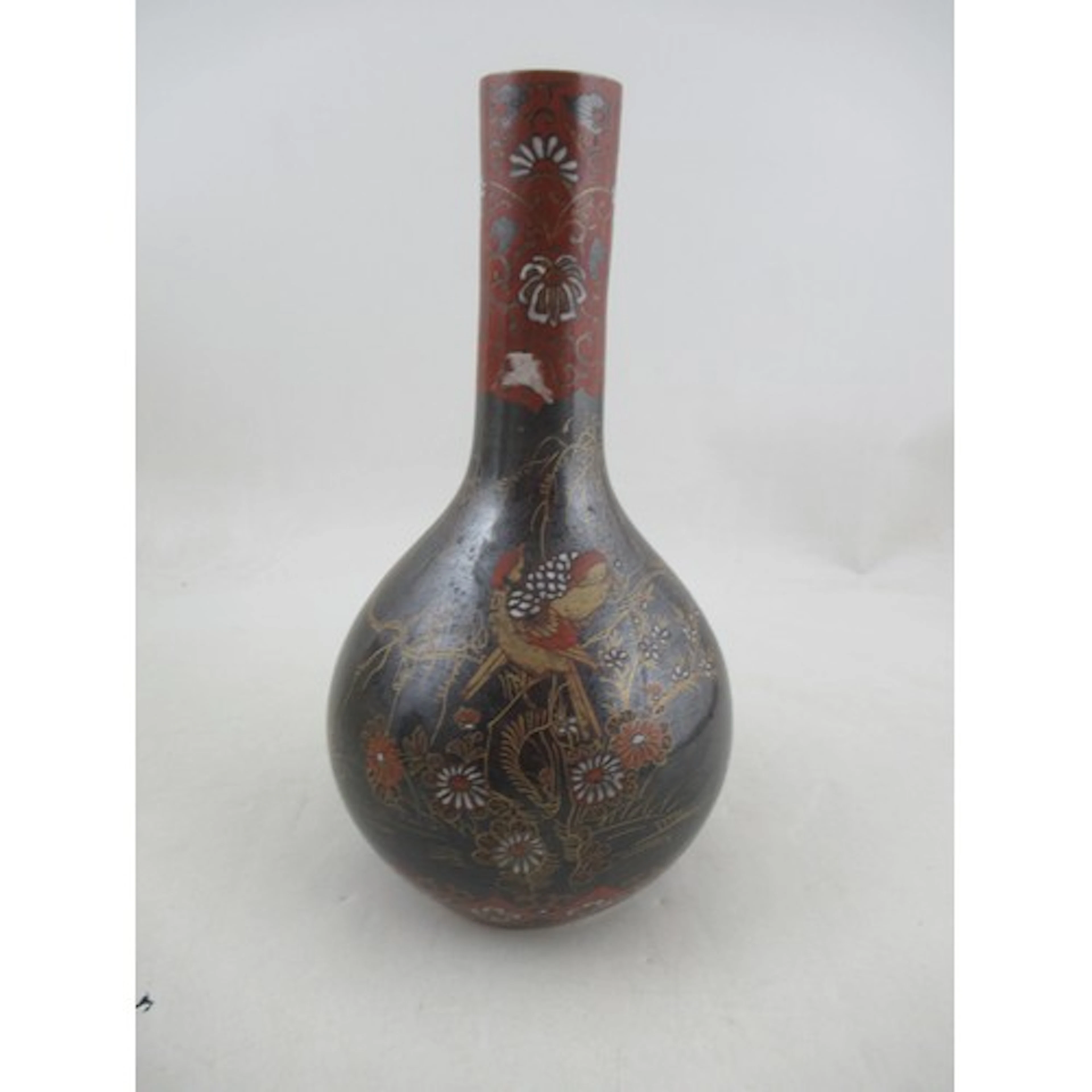 A Japanese bottle vase, decorated in the cloisonne style wit...