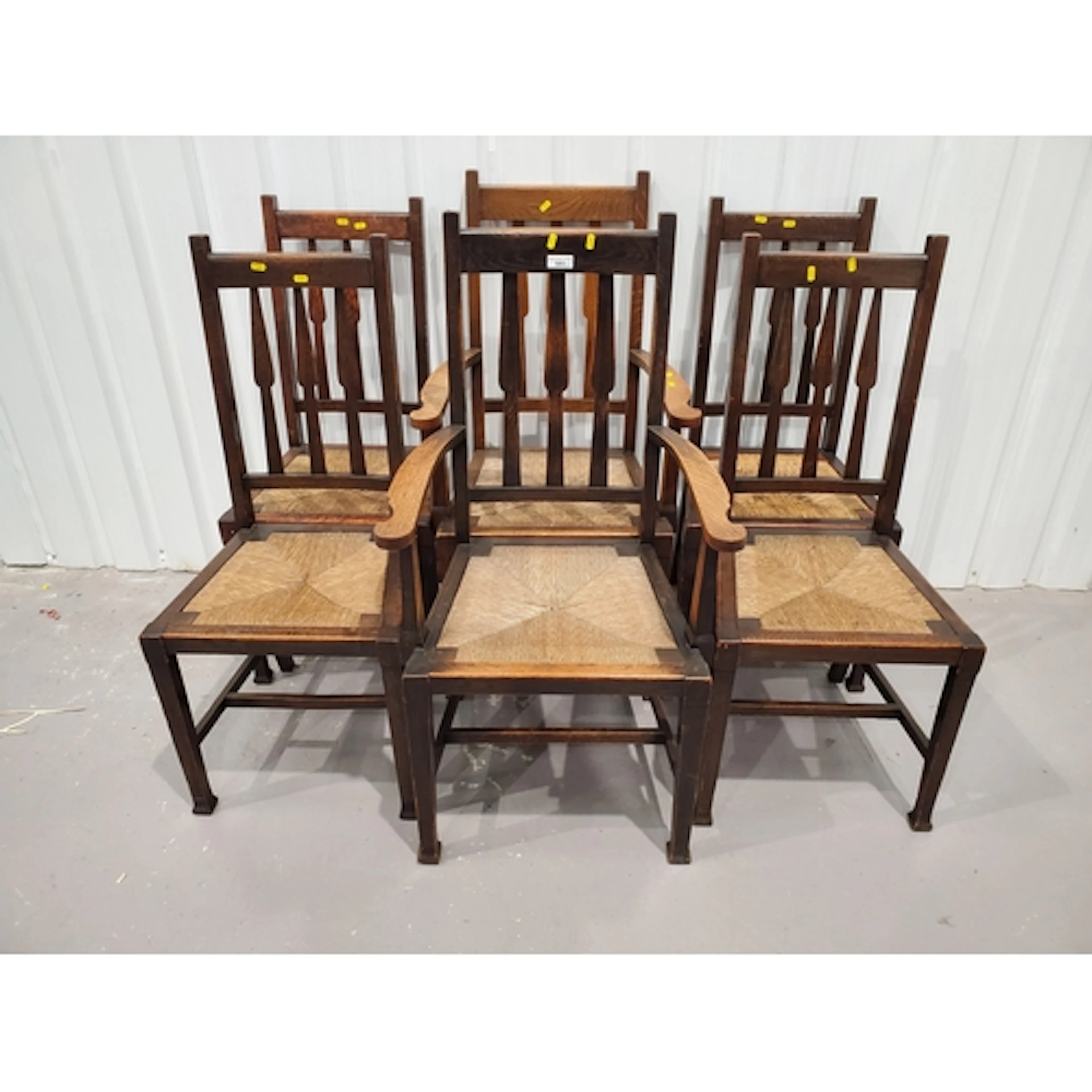 A set of six oak Arts & Crafts Dining Chairs with rush seats...