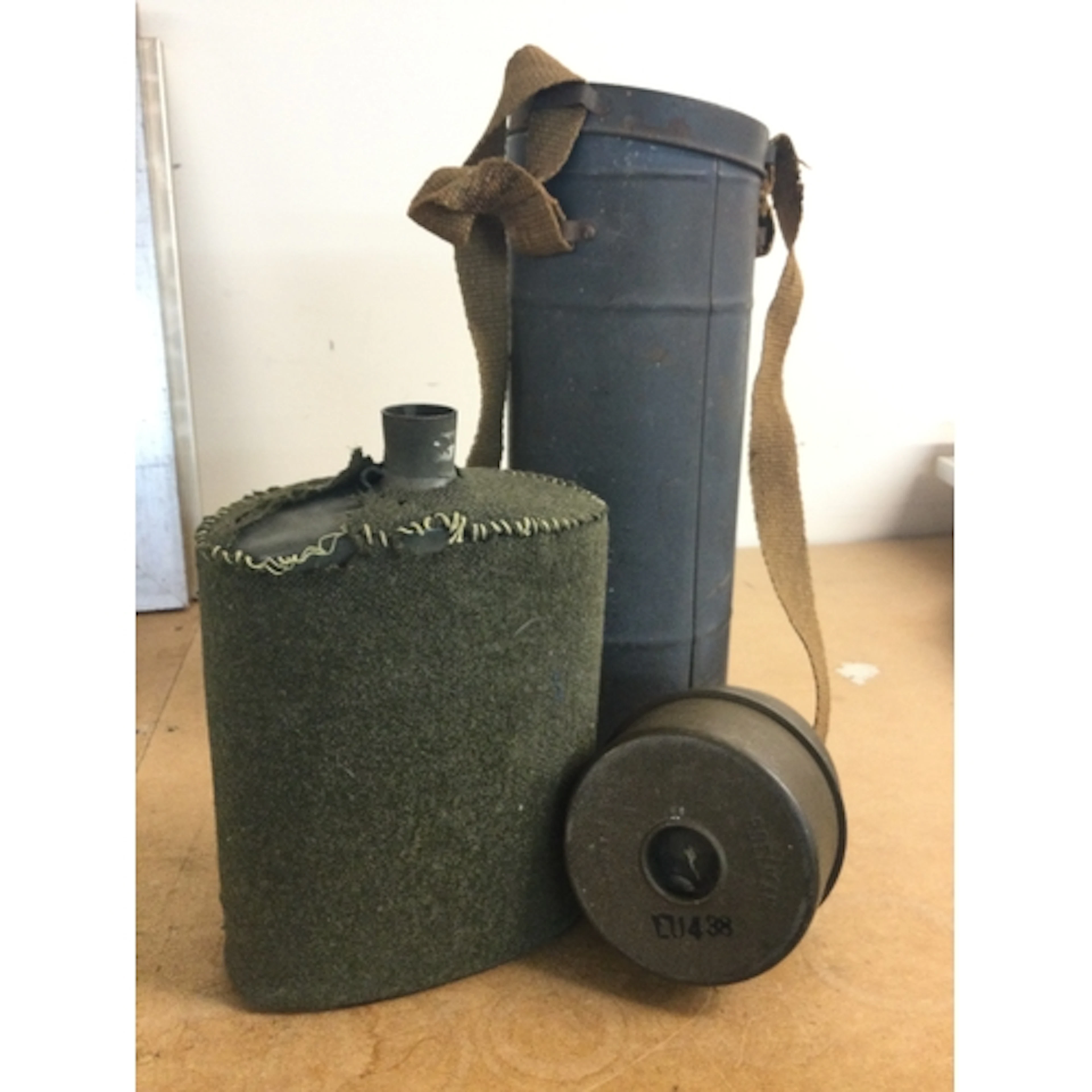 A British WW2 water bottle and a Poelman gas mask air filter...