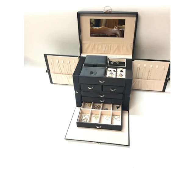 large travel case with silver rings, necklaces