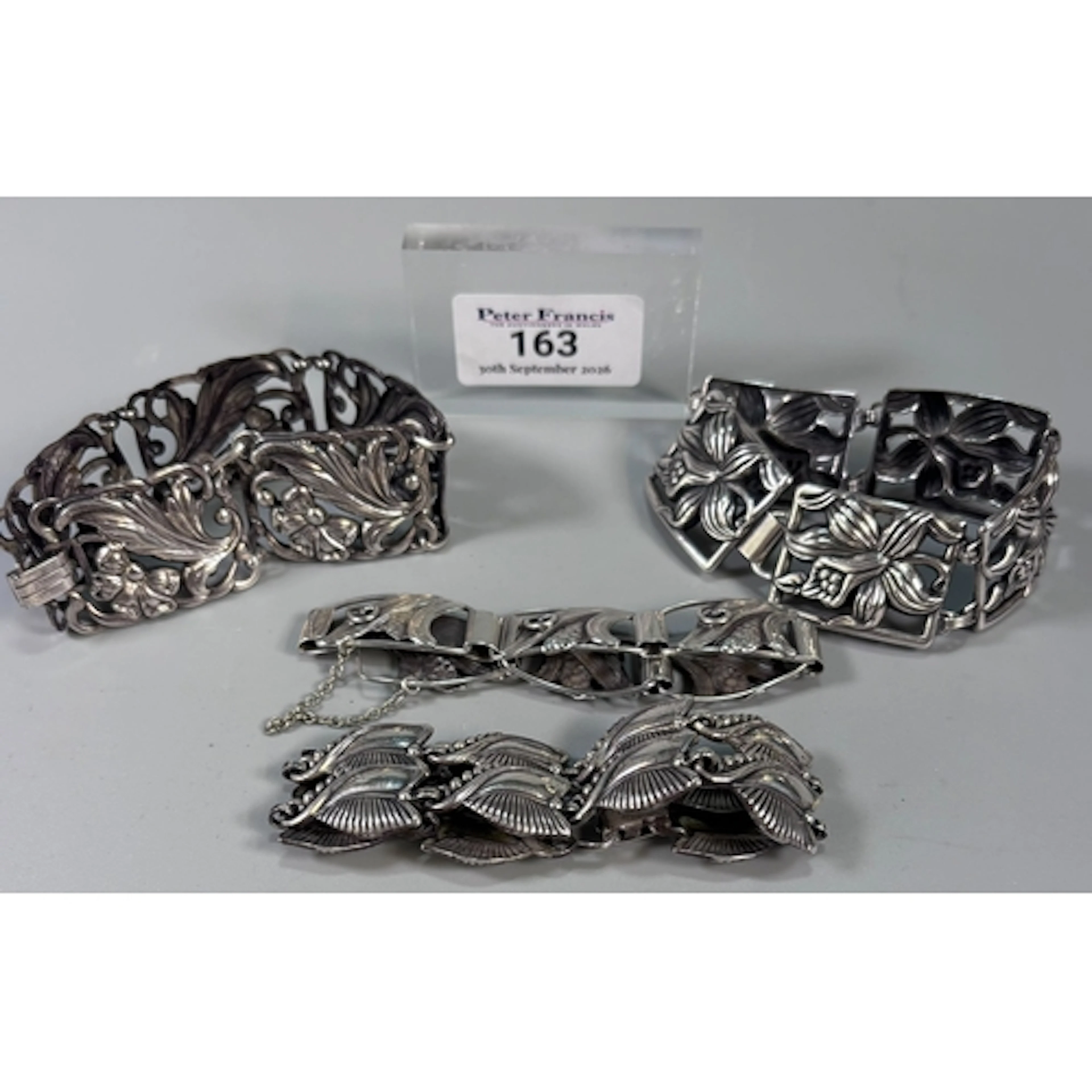 Three silver Scandinavian Danecraft bracelets with floral an...