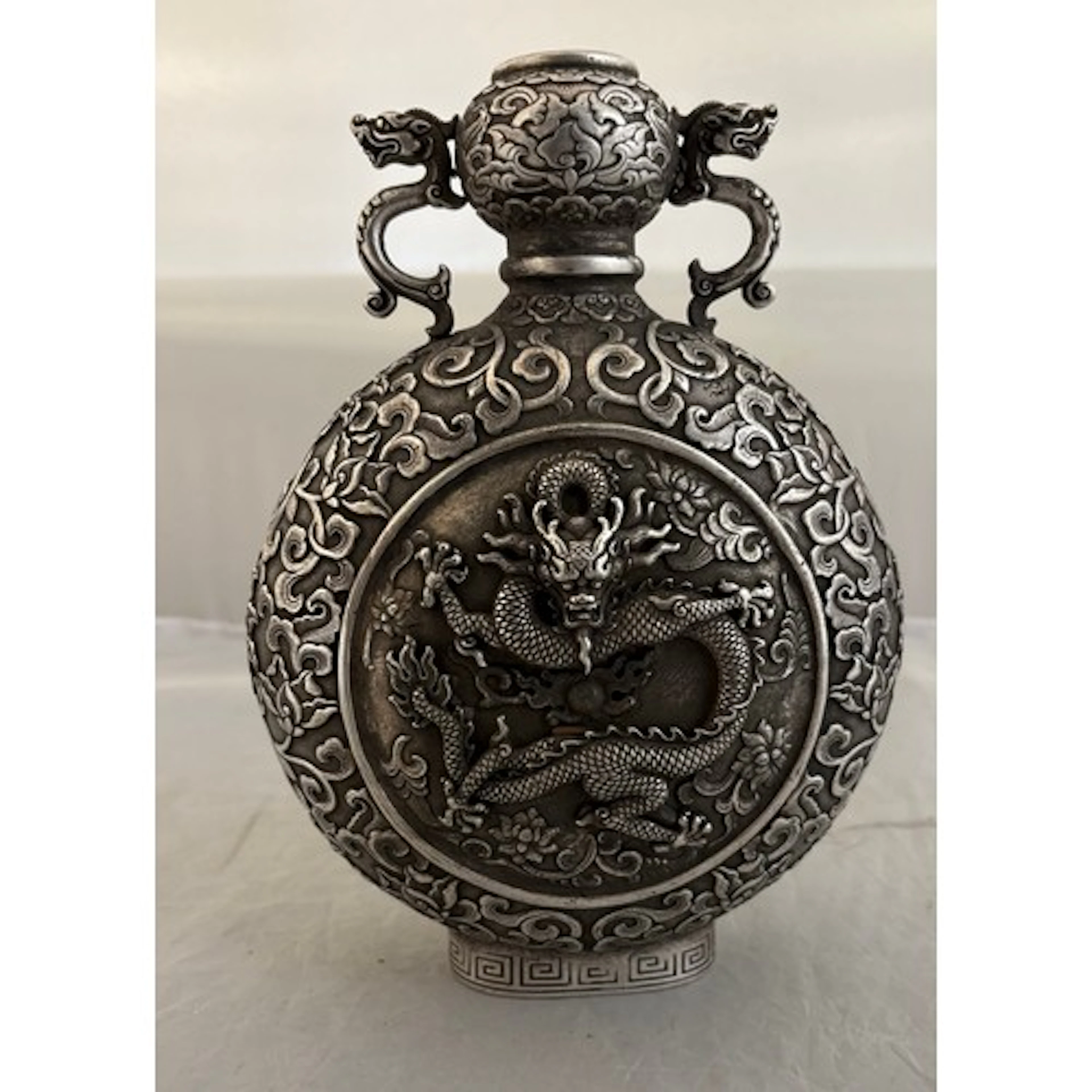 A modern Chinese white metal moon vase