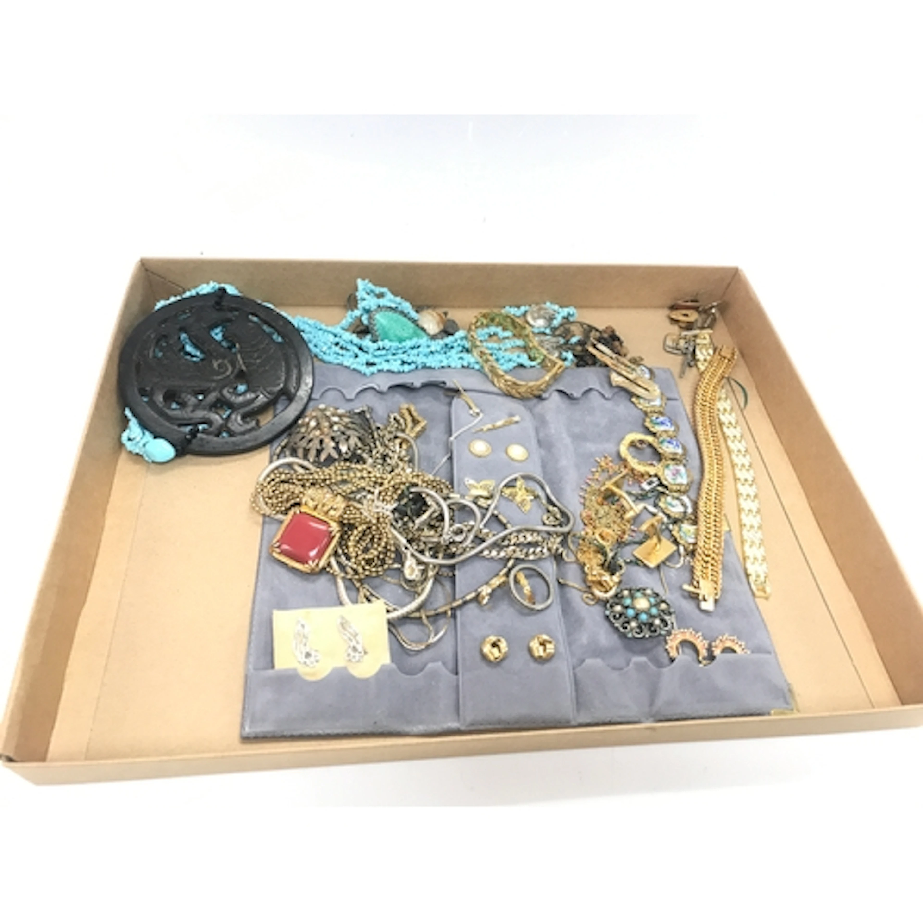 White and gold metal dress jewellery.