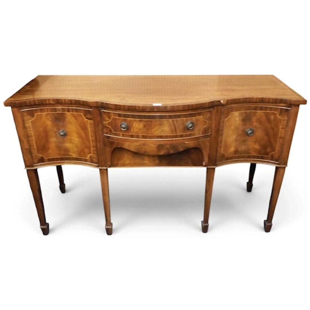 A 20th century mahogany veneered reproduction serpentine fro...
