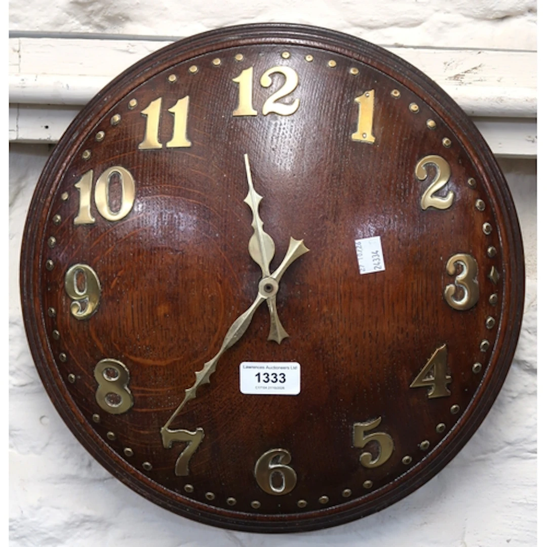 Retailed by Heals, Arts & Crafts circular oak wall clock, wi...