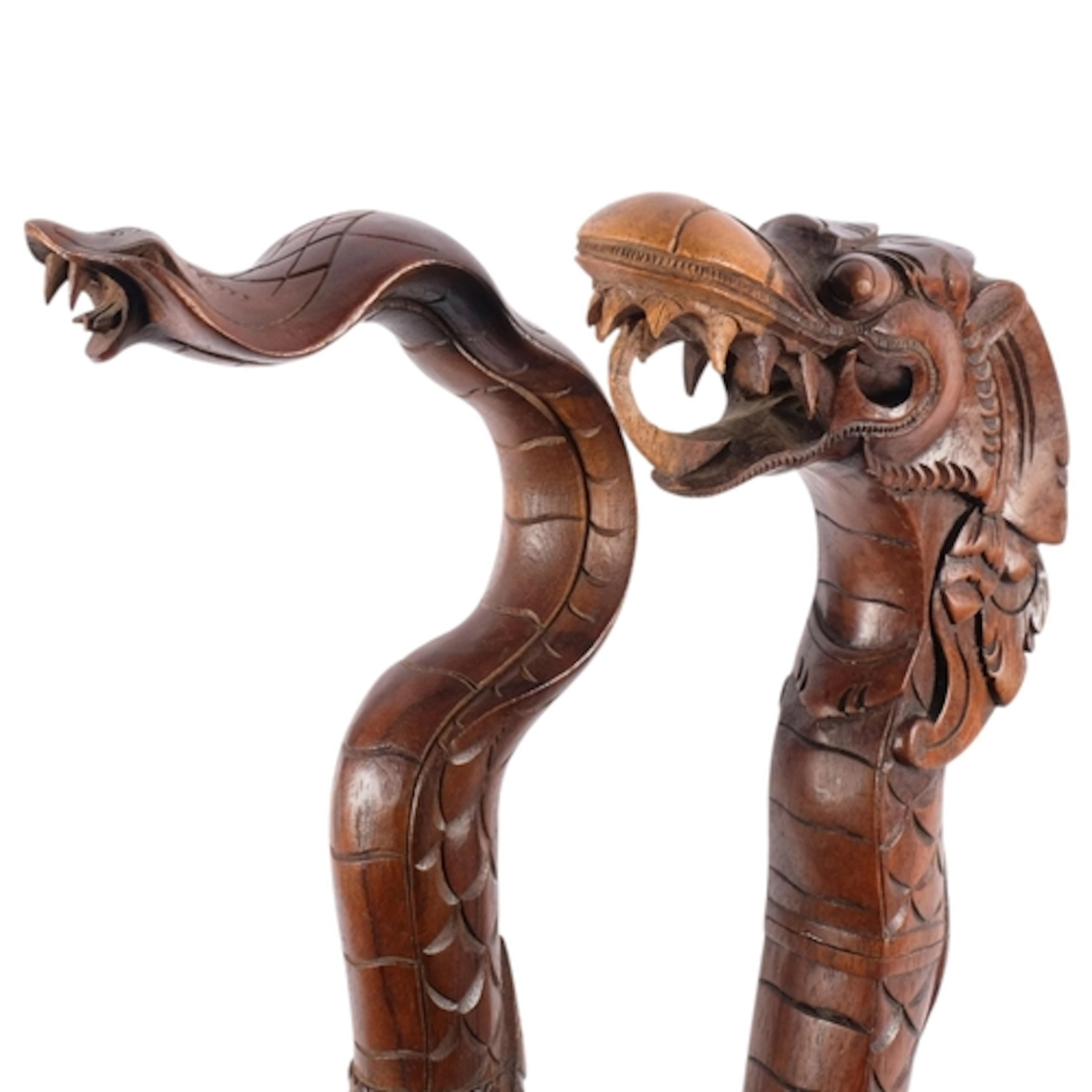 2 carved wood walking canes, 1 in the form of a cobra, the o...