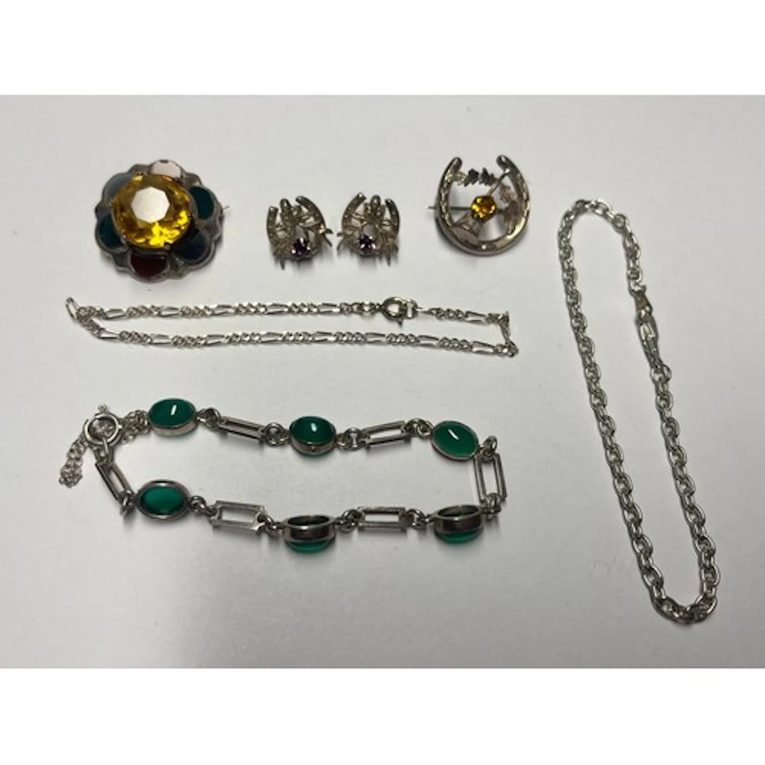 A pair of silver earrings, an agate bracelet, two silver bro...
