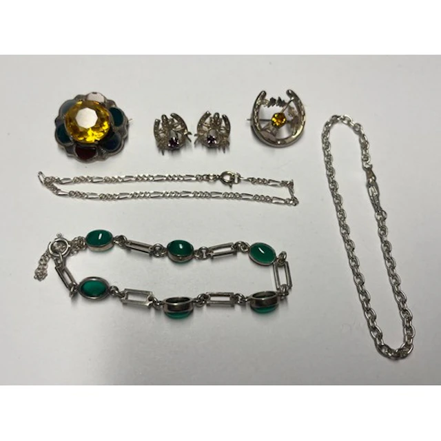 A pair of silver earrings, an agate bracelet, two silver bro...
