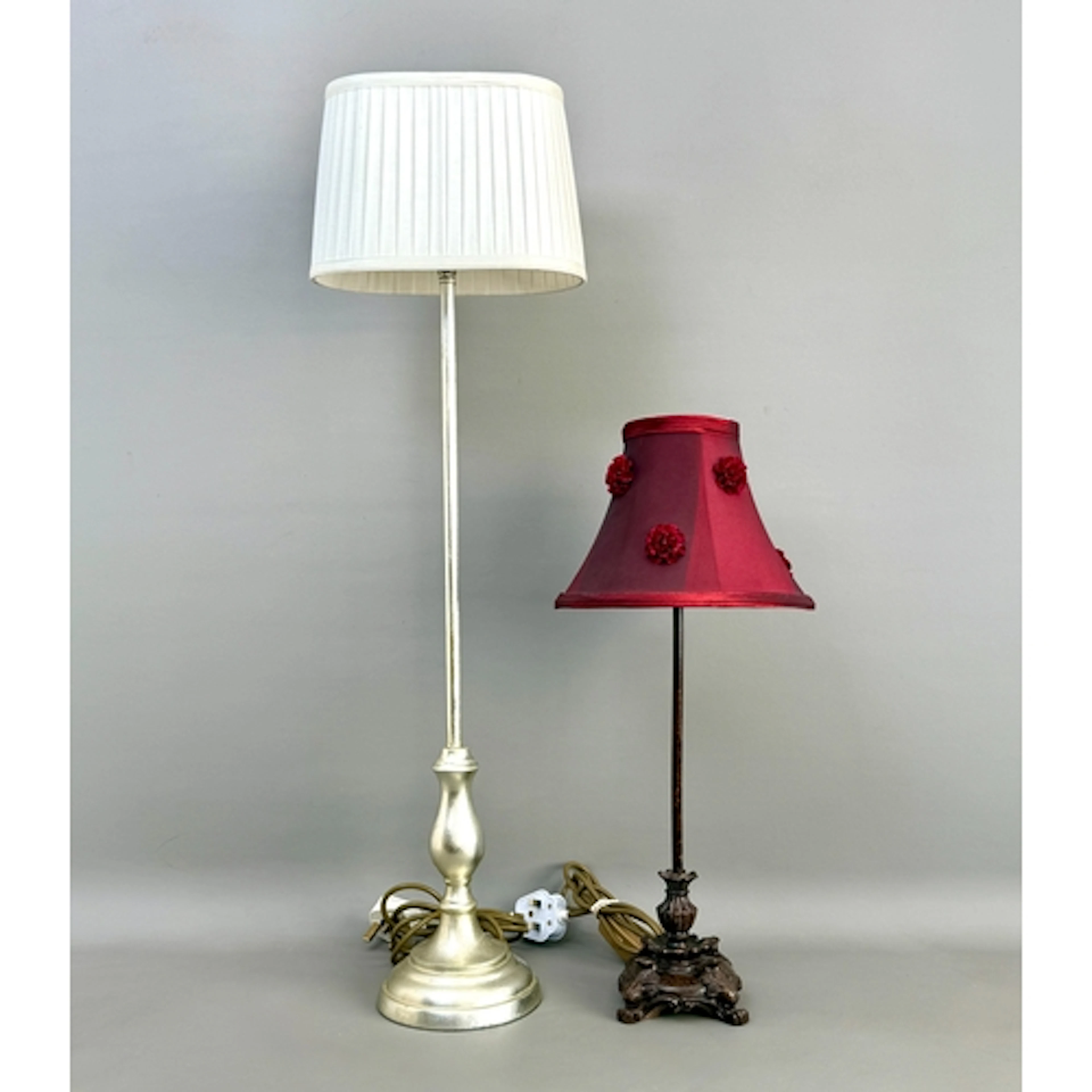 Two contemporary table lamps - one in a brushed, silvered fi...