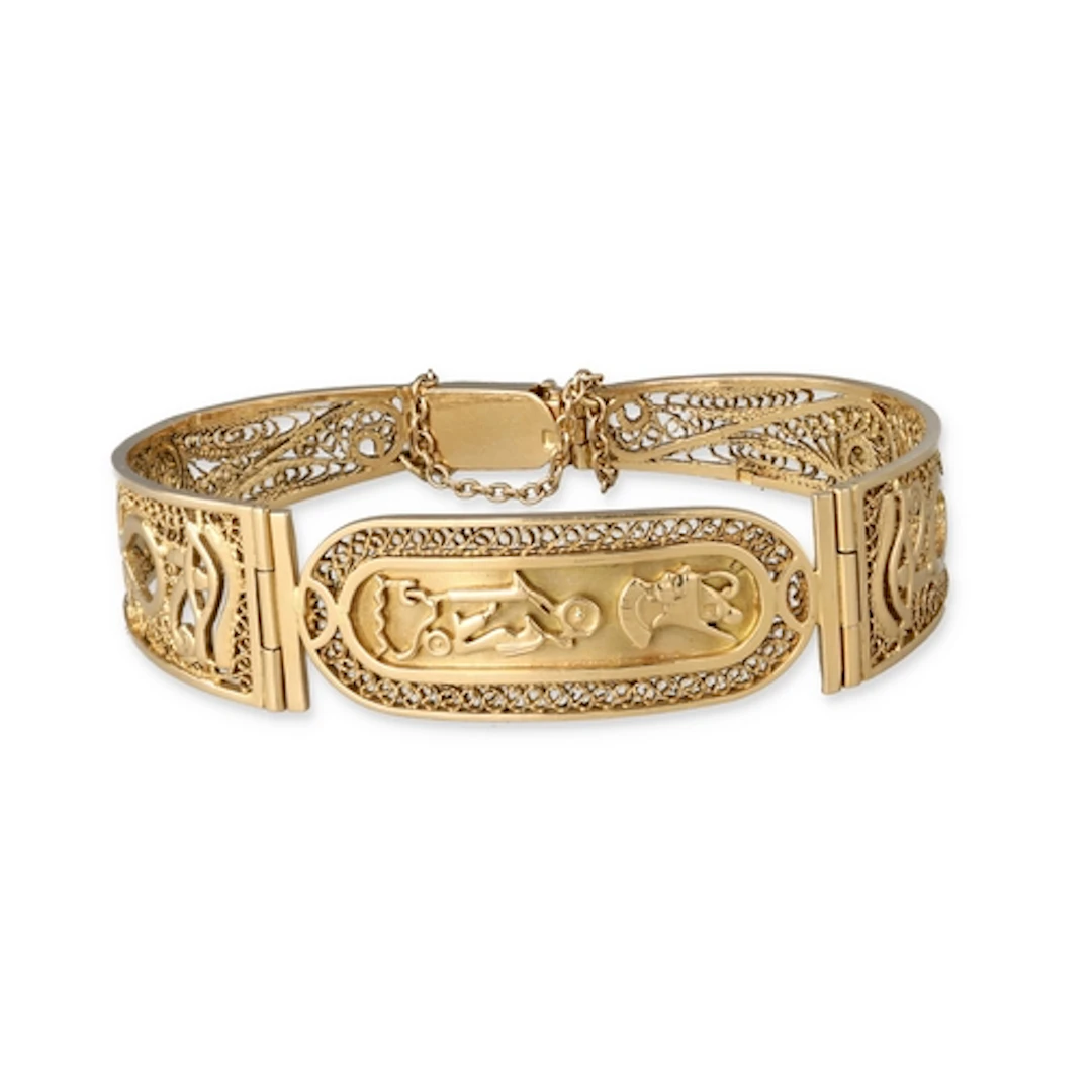 AN 18CT GOLD EGYPTIAN BRACELET Decorated with hieroglyphs an...