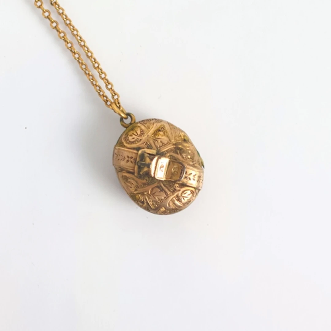 A 19th century locket/pendant, the oval locket with applied ...