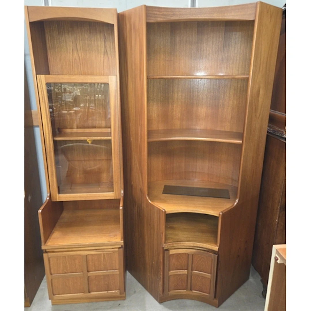 A mid 20th century teak full height corner unit and matching...