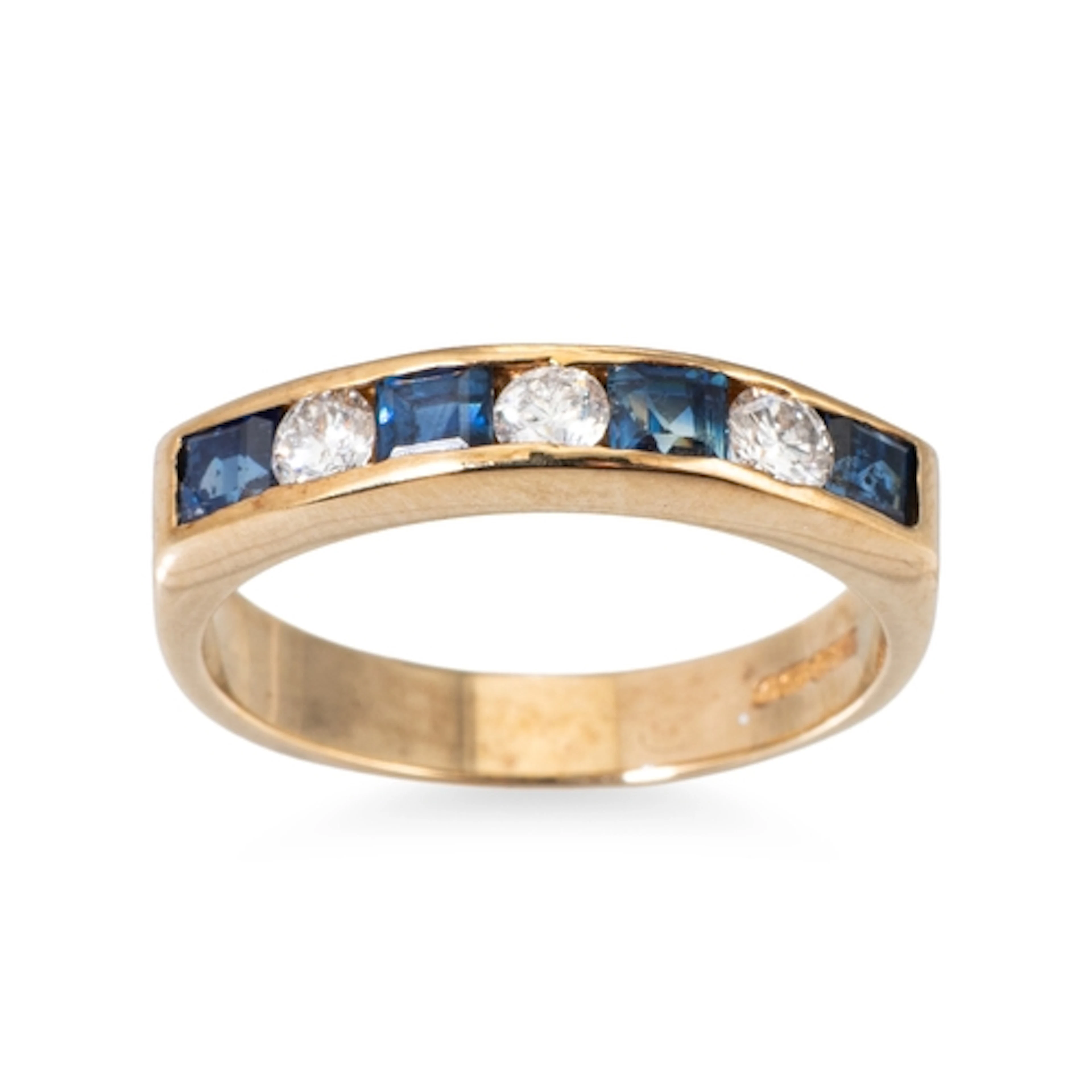 A SAPPHIRE AND DIAMOND HALF ETERNITY RING, mounted in 9ct ye...