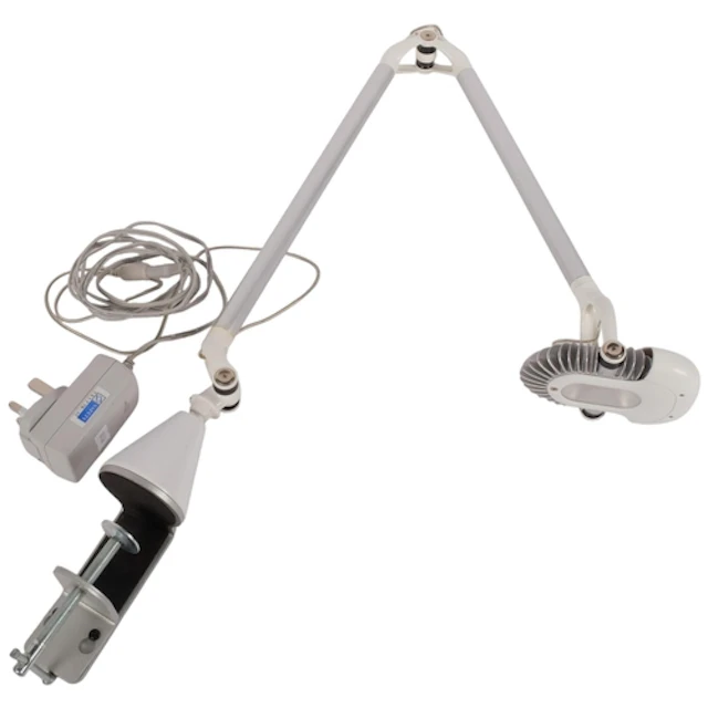 A Humanscale adjustable LED task light, with heavy duty tabl...