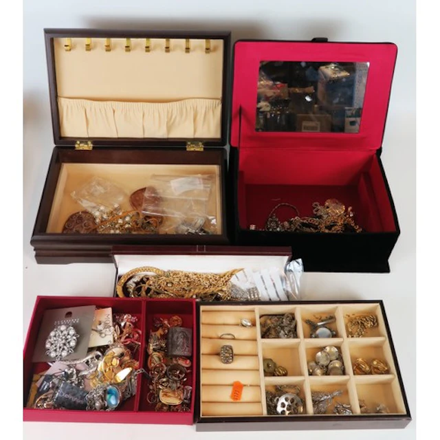 Two cases of costume jewellery including yellow metal neckla...