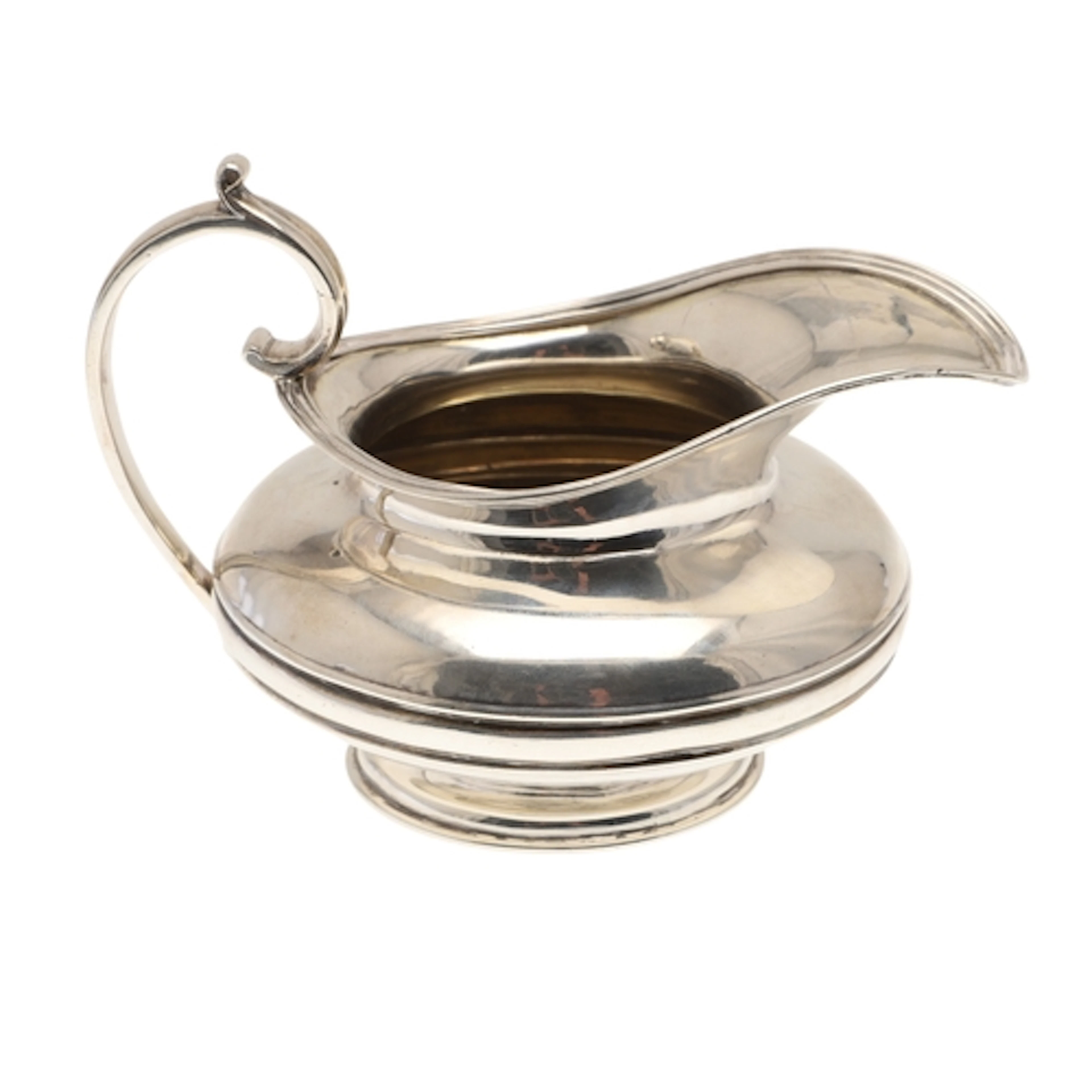 A WILLIAM IV SILVER MILK JUG. The bulbous body with a reeded...