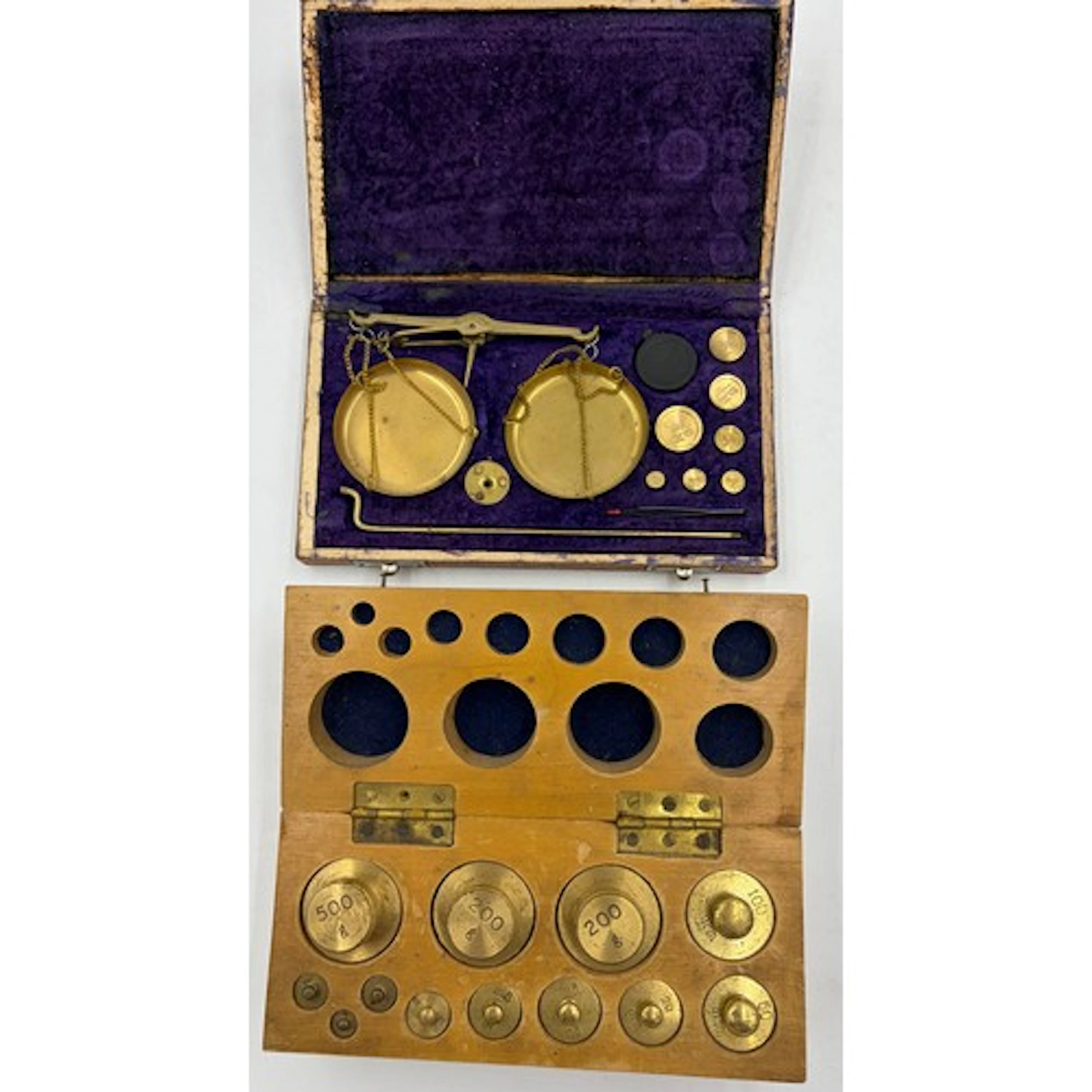 A boxed set of Apothecary weights ranging from 1gm to 500gms...